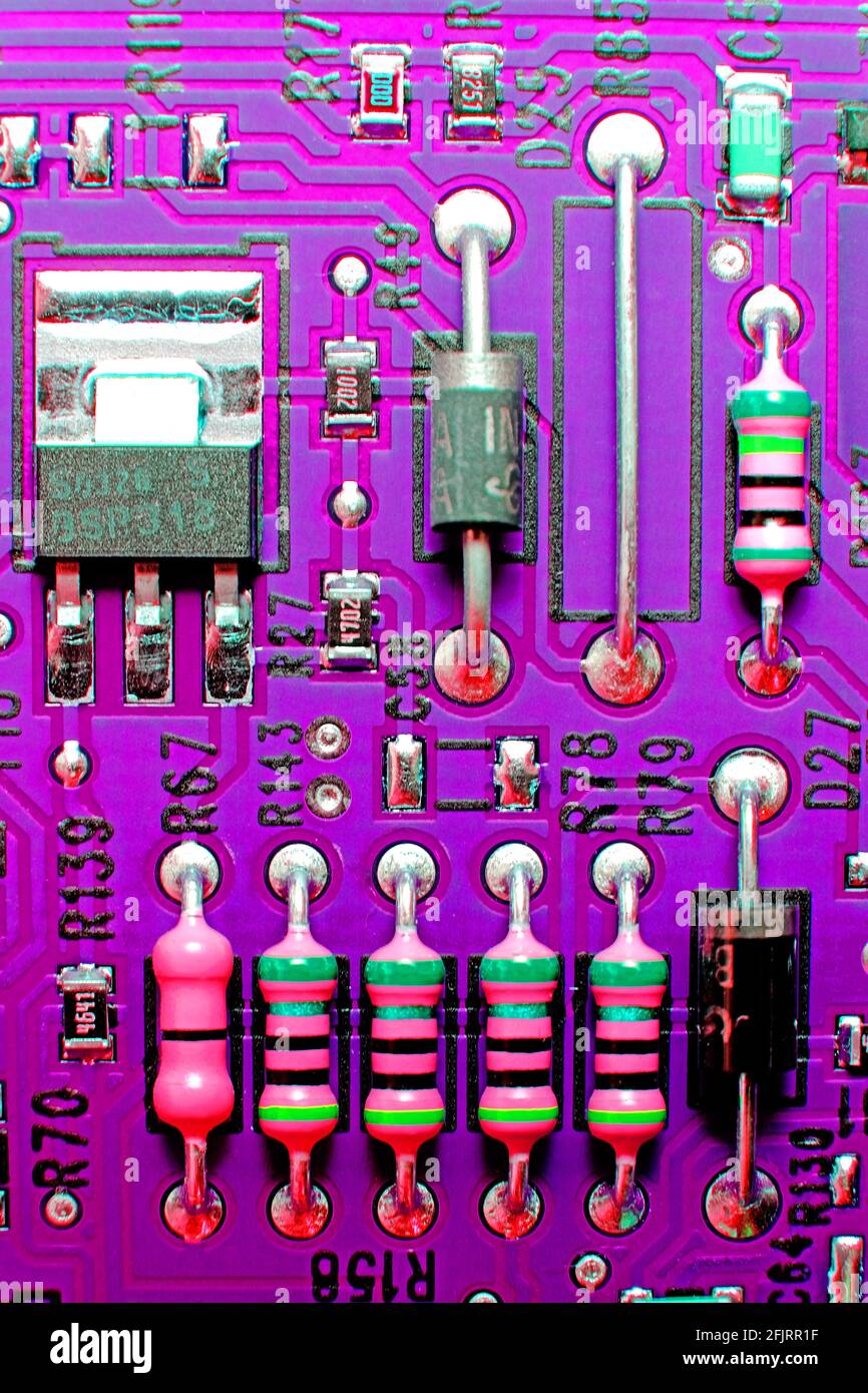 Abstract circuit board and transistors with purple background Stock Photo