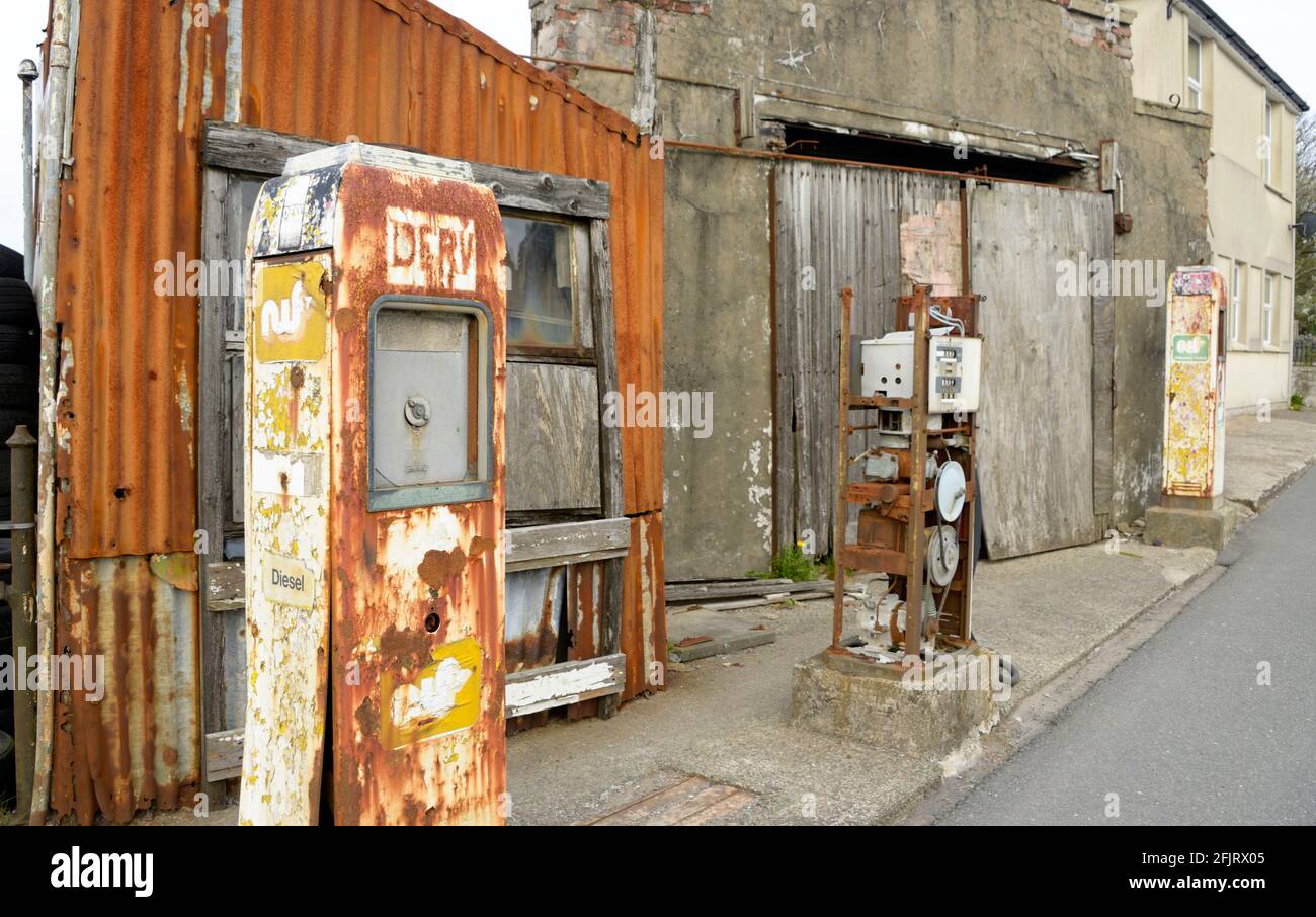 Old Garage with rusty pumps & signs, in Wales. Stock Photo