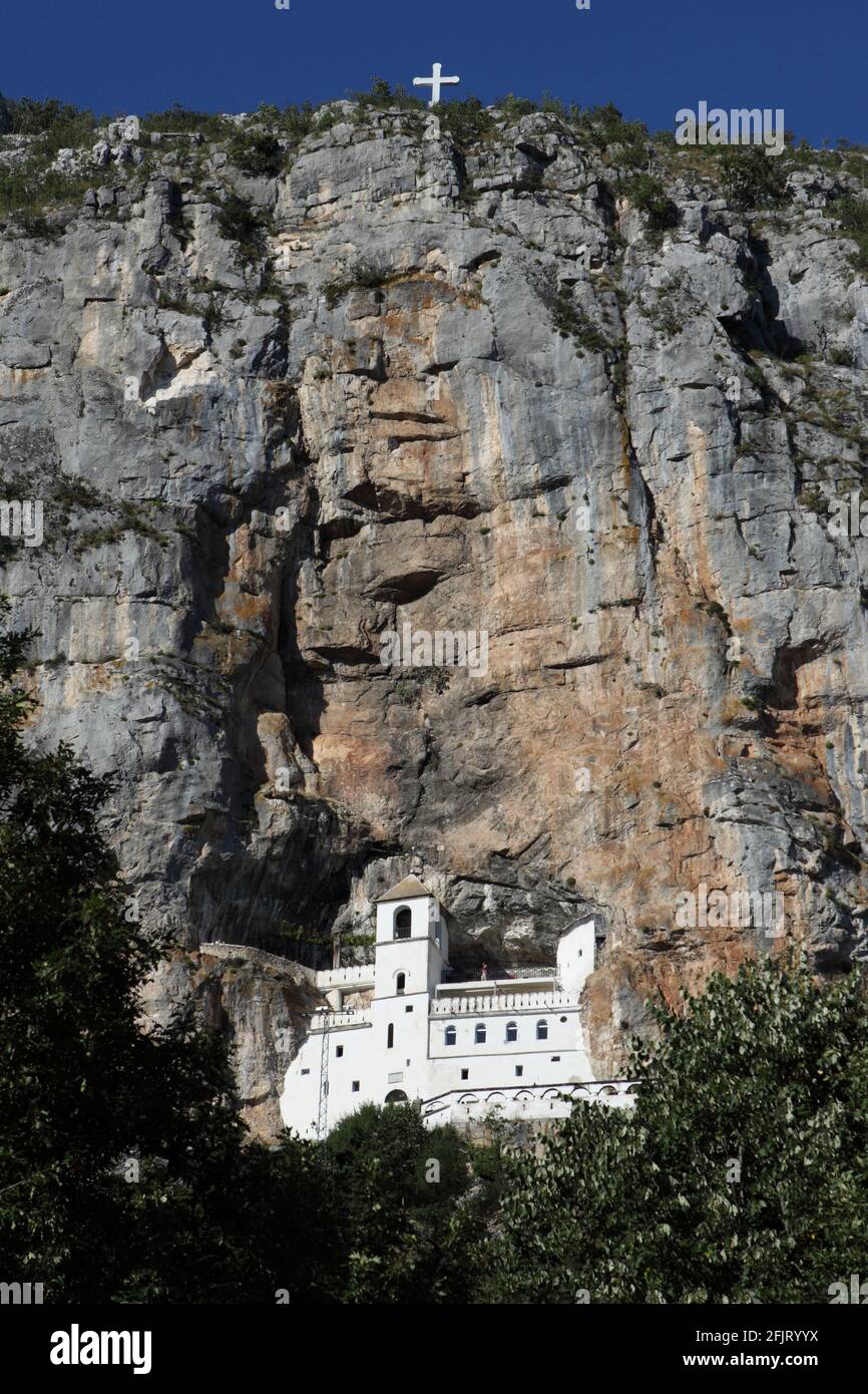 The Serbian Orthodox Ostrog Monastery hanging on a cliff in Montenegro ...