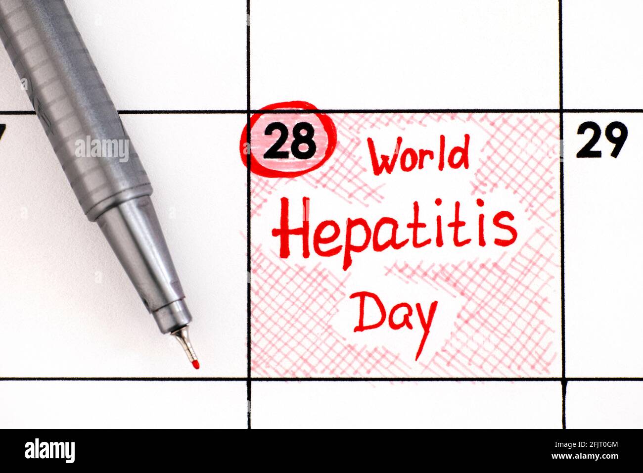 Reminder Reminder World Hepatitis Day in calendar with pen.  in calendar with pen. July 28 Stock Photo