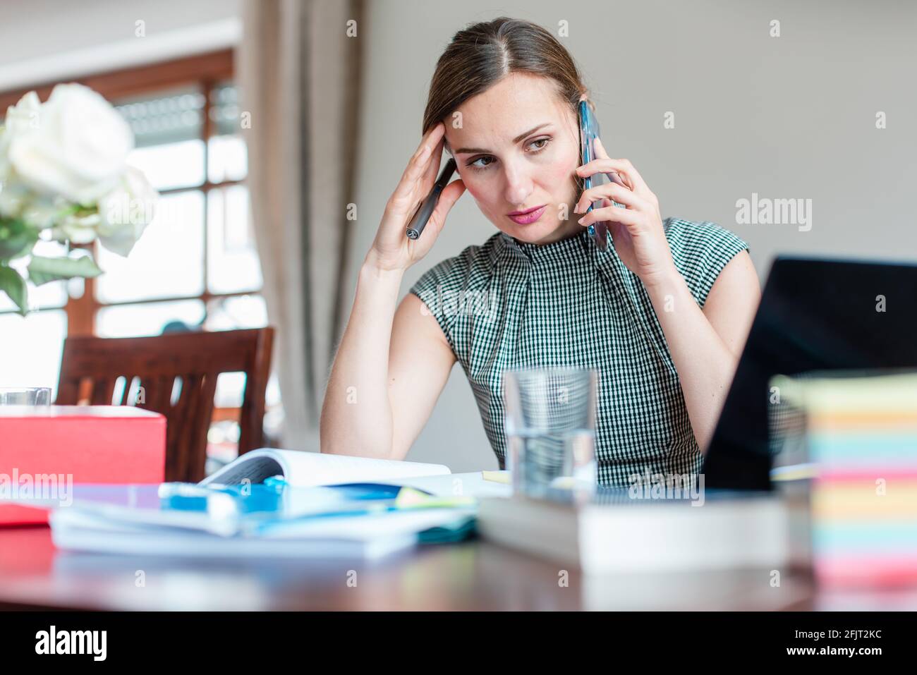 Businesswoman has to work from home during covid 19 lockdown Stock Photo