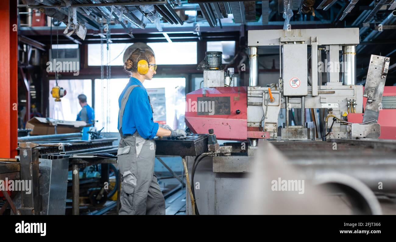 Female factory operating machine hi-res stock photography and images ...