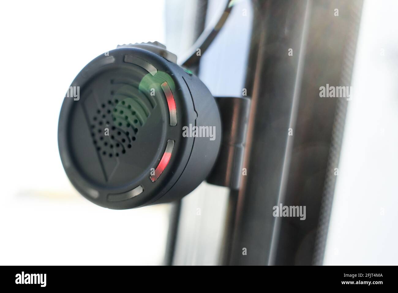 Hamburg, Germany. 26th Apr, 2021. A signal transmitter is seen near the right rearview mirror inside a bus at a press event for the presentation of a turn-off assistance system for buses of Hamburger Hochbahn. To protect cyclists and pedestrians, Hamburger Hochbahn plans to equip its more than 1000 buses with turn assist systems by the end of 2022. Credit: Christian Charisius/dpa/Alamy Live News Stock Photo