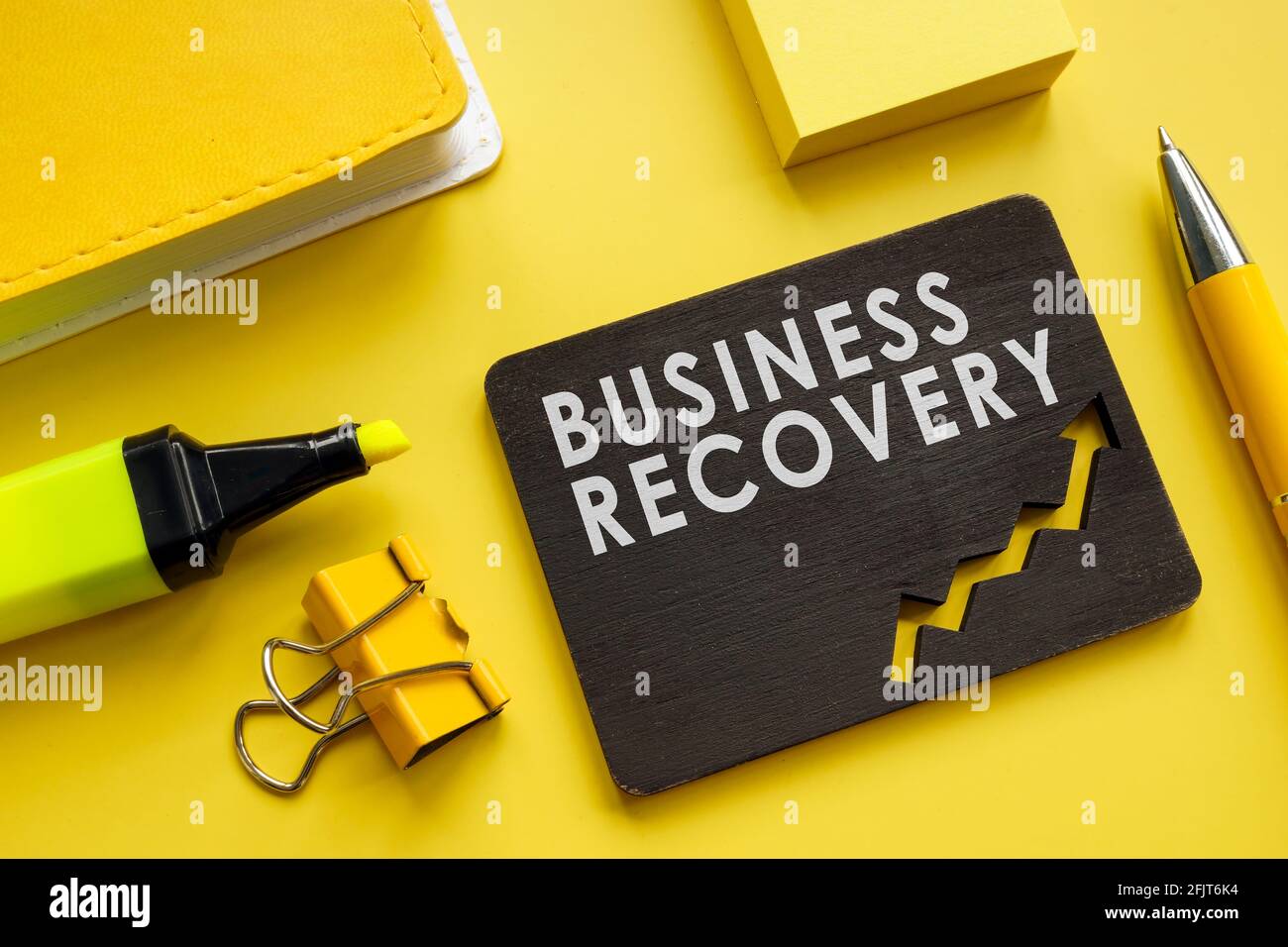 Business Recovery concept. Notepad, pen and marker. Stock Photo