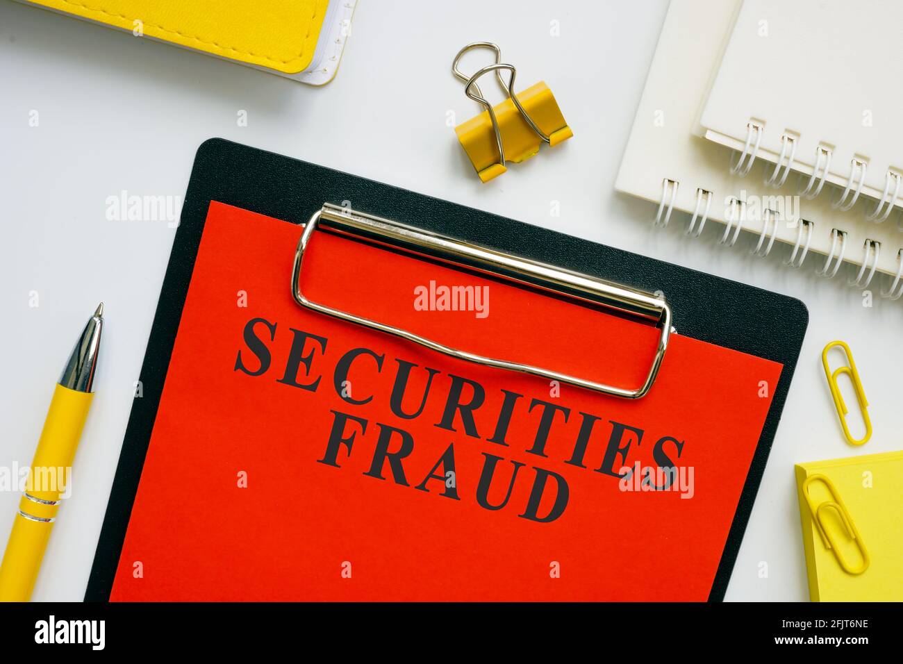 Investment or Securities fraud report on red form. Stock Photo