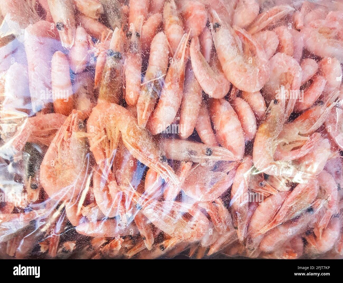 Boiled shrimp in plastic packaging, food background Stock Photo - Alamy