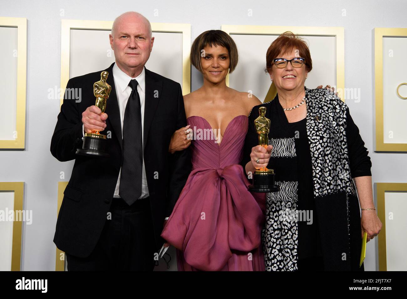 Los Angeles, USA. 25th Apr, 2021. Halley Berry (Center) poses Donald Graham (L) and Jan Pascale (R) backstage with the Oscar® for Production Design during the live ABC Telecast of The 93rd Oscars® at Union Station in Los Angeles, CA on Sunday, April 25, 2021. (Photo courtesy Matt Petit/A.M.P.A.S. via Credit: Sipa USA/Alamy Live News Stock Photo