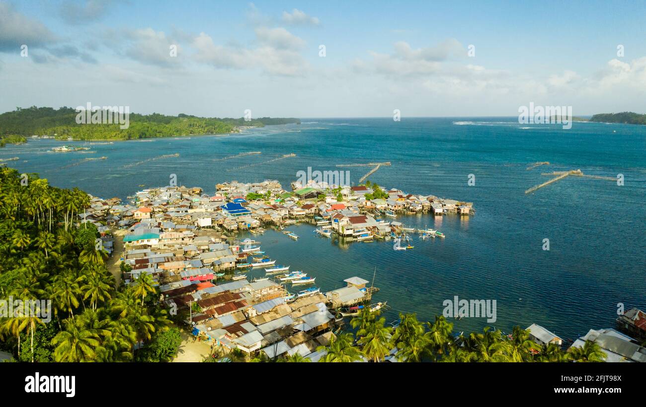 Village of fishermen with houses on the water, with fishing boats ...