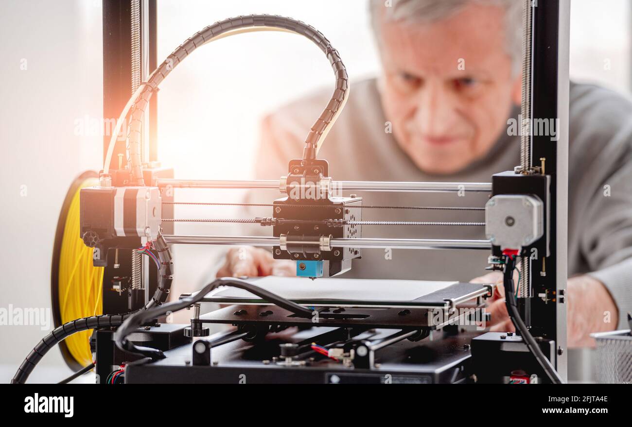 Man with 3D printer Stock Photo
