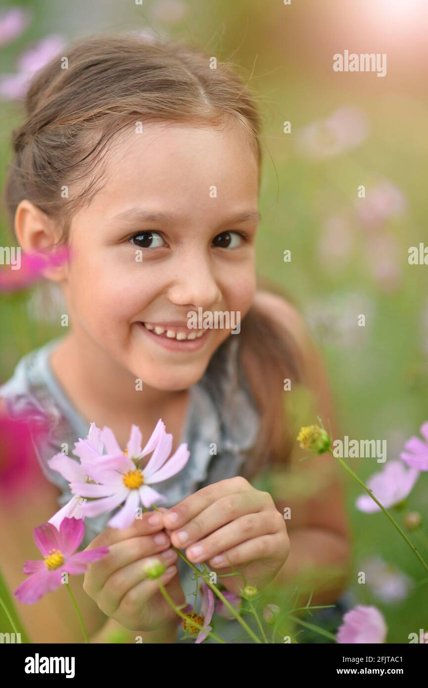 Portrait of cute little girl in park Stock Photo Alamy