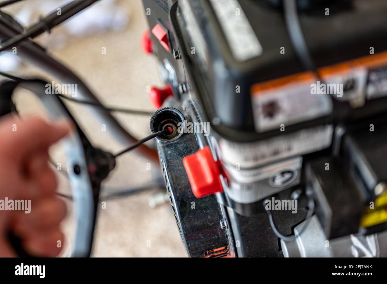 Engine pull cord on a snow blower or lawn mower used to start the