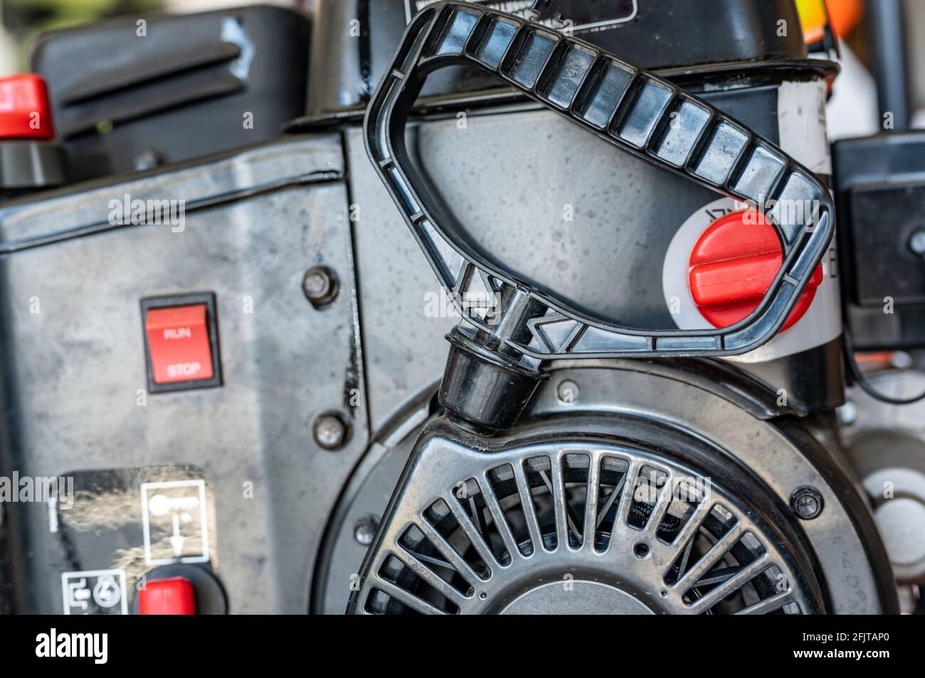 Engine pull cord on a snow blower or lawn mower used to start the