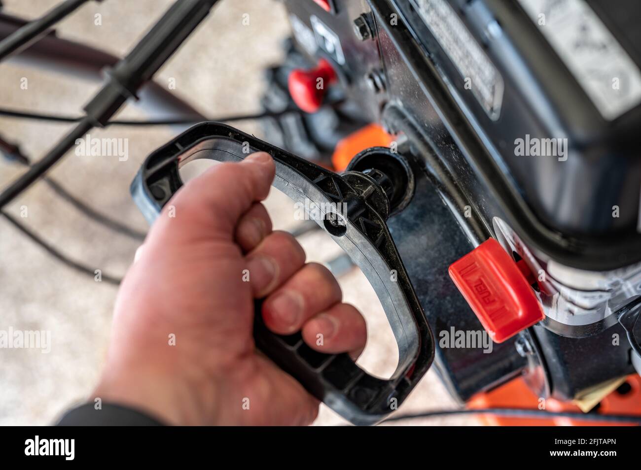 Engine pull cord on a snow blower or lawn mower used to start the device Stock Photo Alamy
