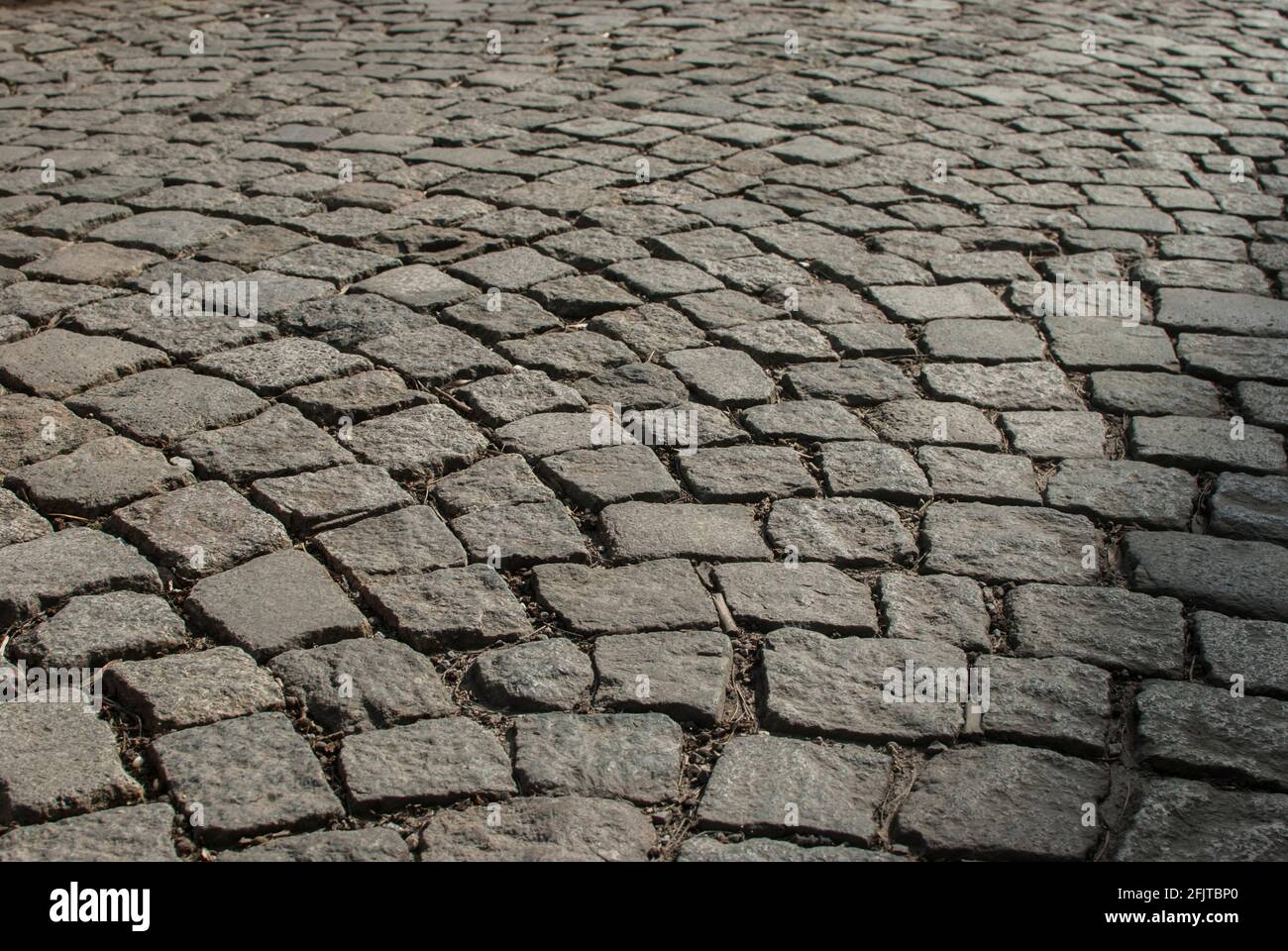 Stone paving roadway surface closeup as stone background Stock Photo
