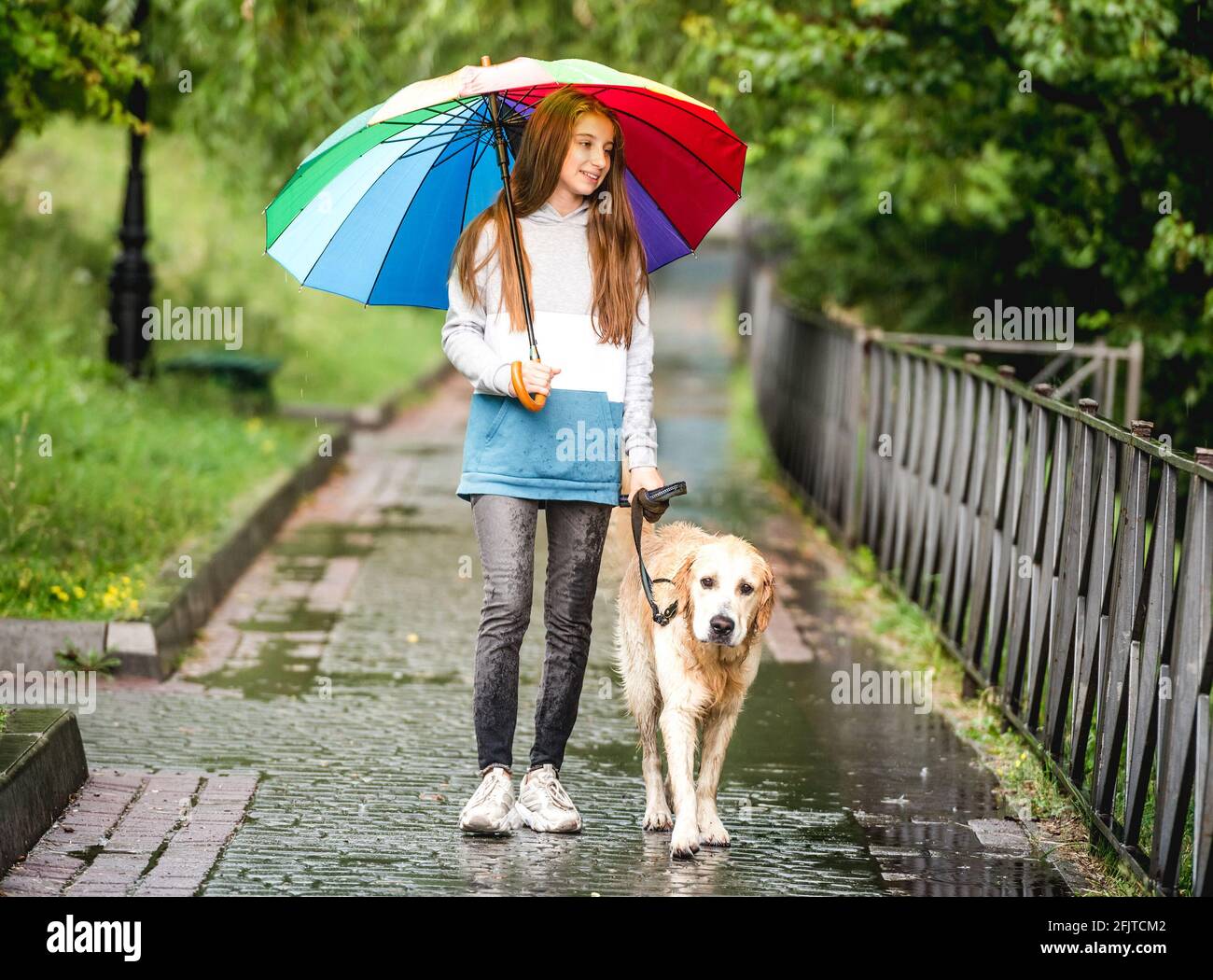 Teen girl walking dog hi-res stock photography and images - Alamy