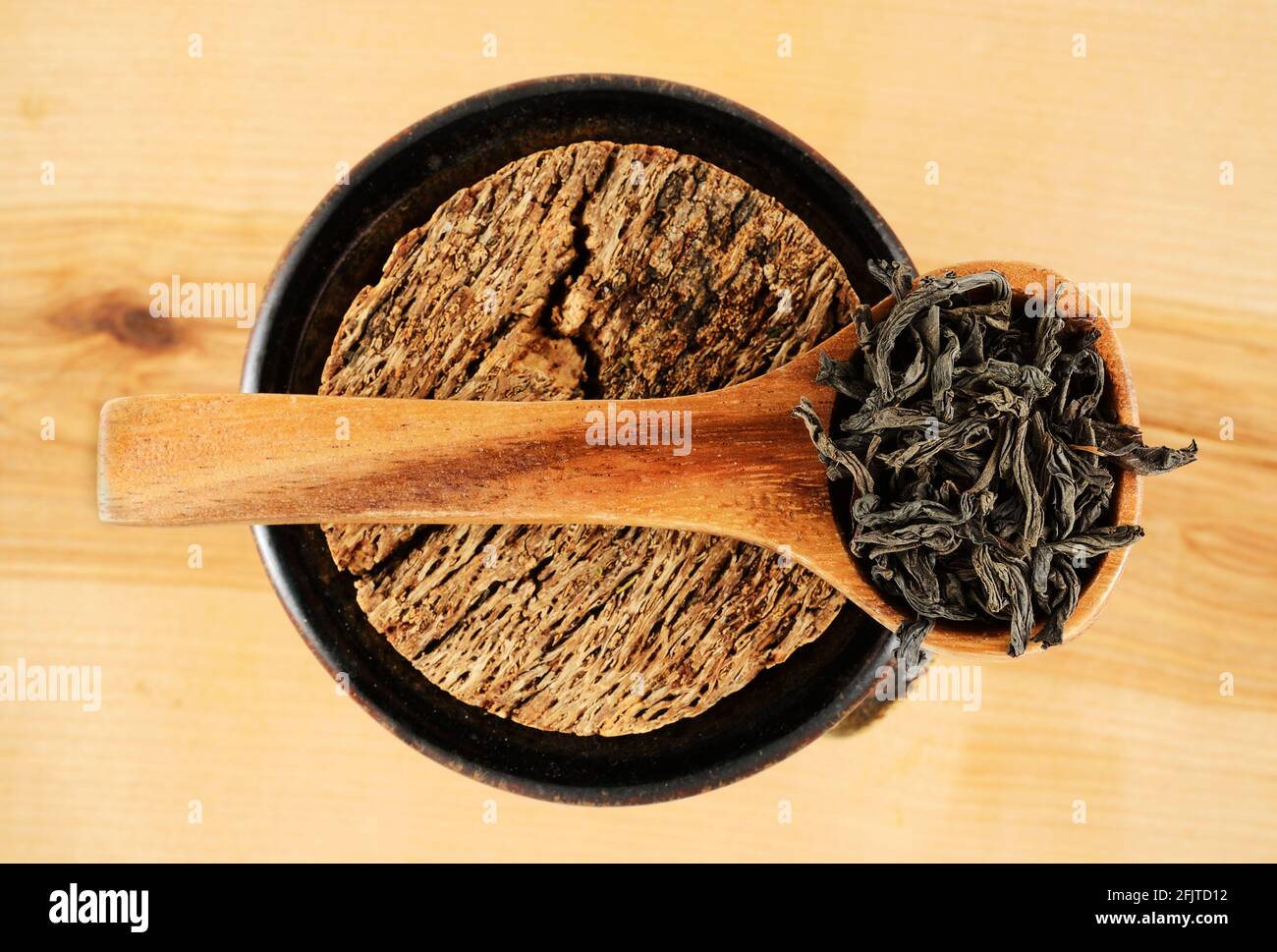 black tea leaves in a wooden spoon Stock Photo