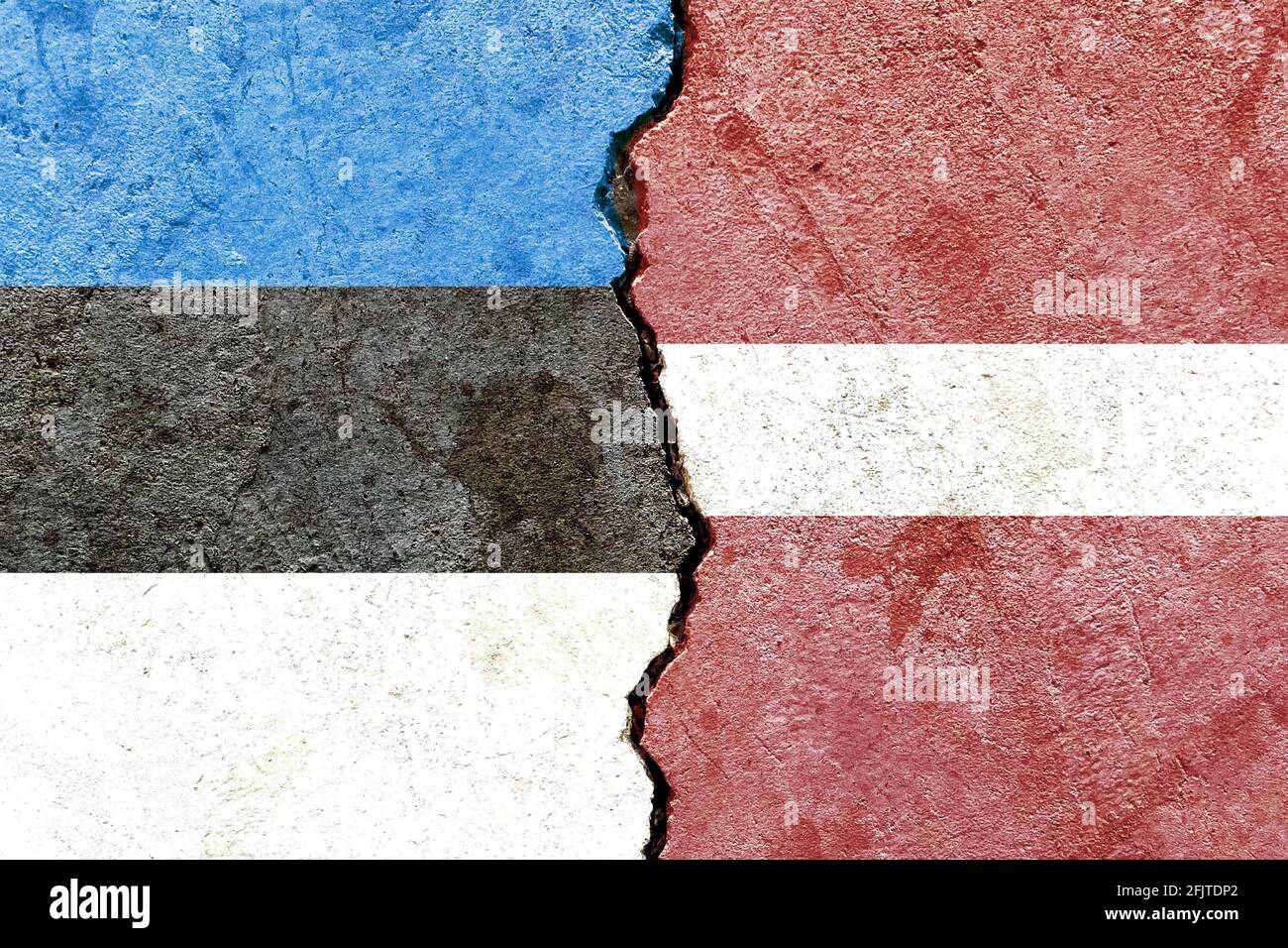 Flags of Latvia and Estonia painted on cracked wall background ...
