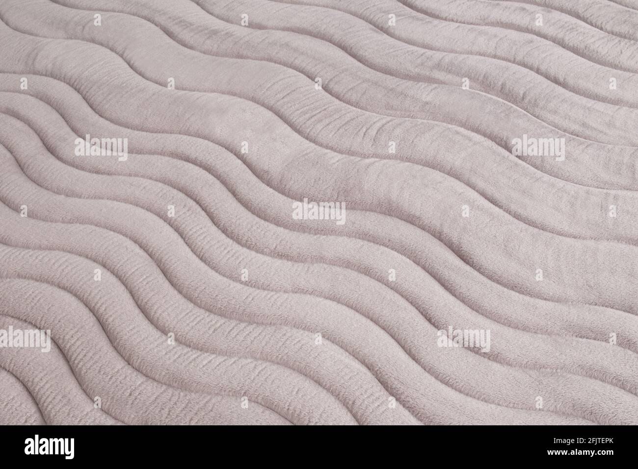 closeup of pattern on the gray mattress, texture surface as background Stock Photo