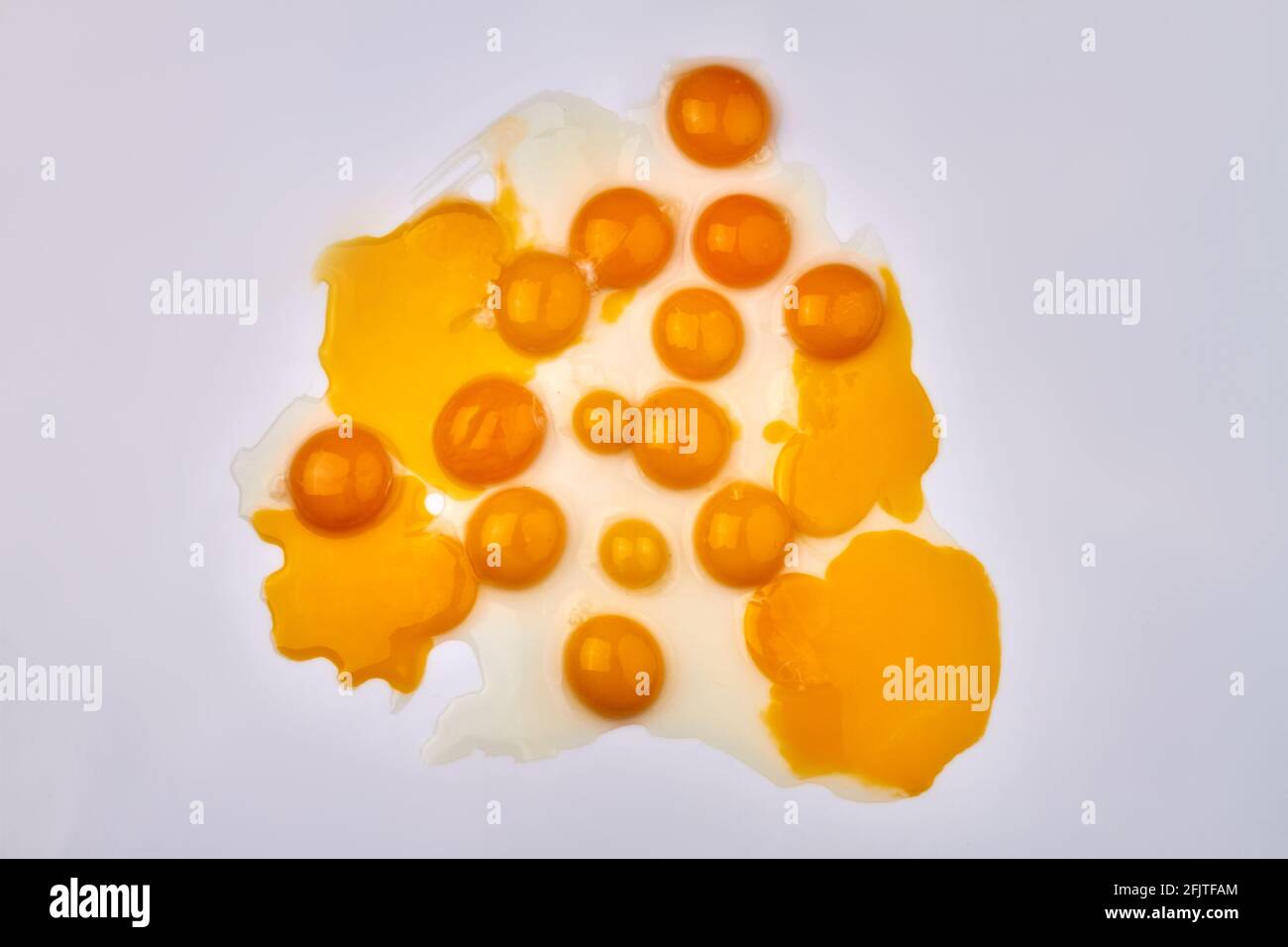 Art composition of egg yolks. Stock Photo