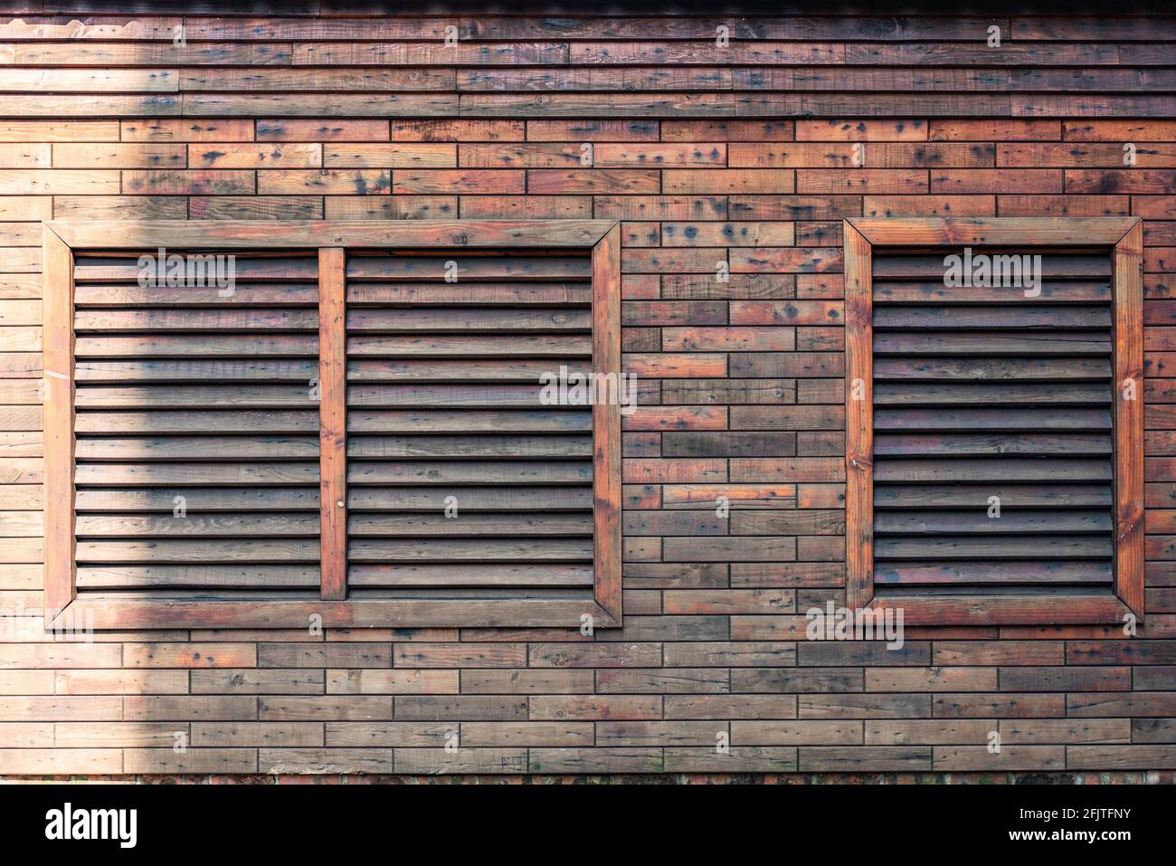 A brick wall with two air condition vents Stock Photo - Alamy