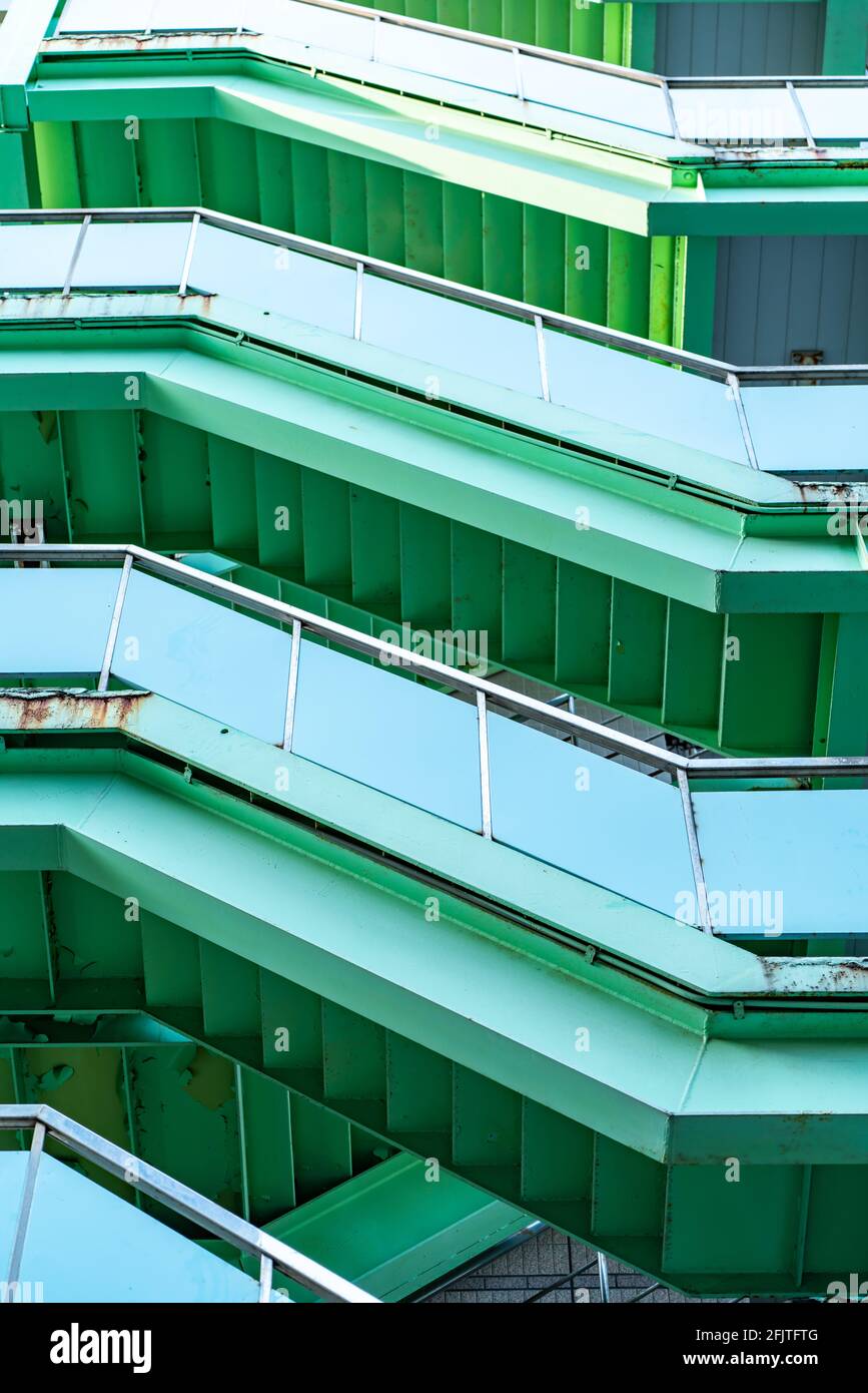 green fire escape ladders on building, Exterior view Stock Photo Alamy