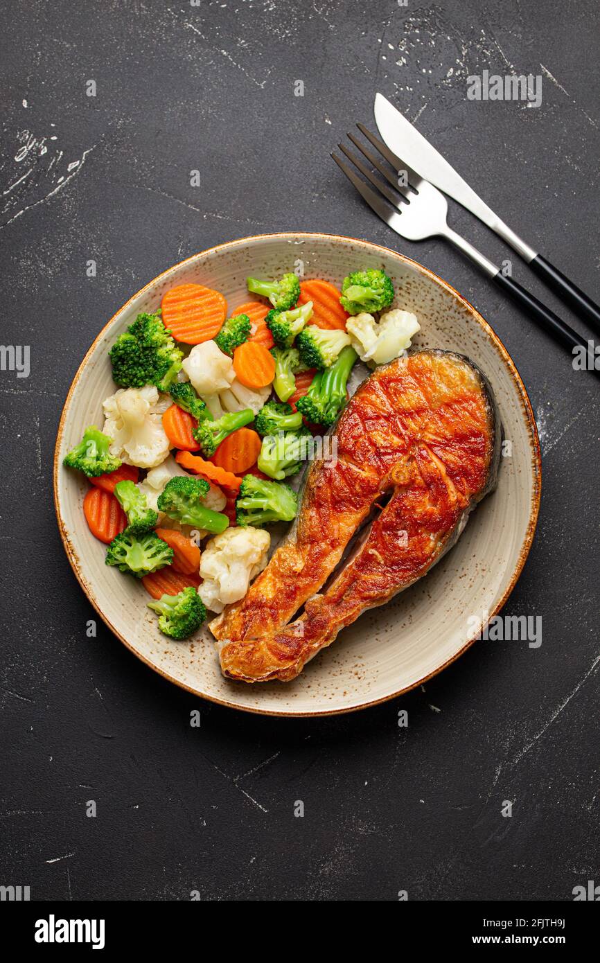 Grilled salmon steak with vegetables salad from above Stock Photo - Alamy