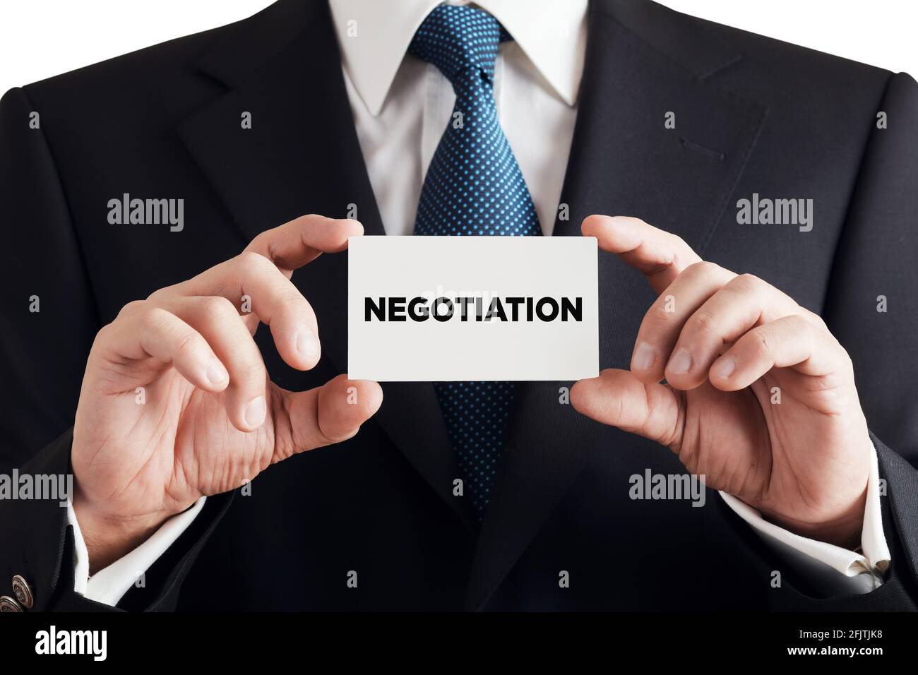 Businessman shows business card with the word negotiation. Business negotiation or professional negotiator concept. Stock Photo