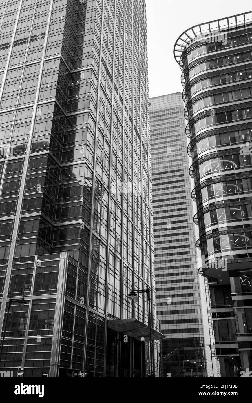 Looking up towards Canada Place and Montgomery Street in Canary Wharf, London, UK. B&W. Stock Photo