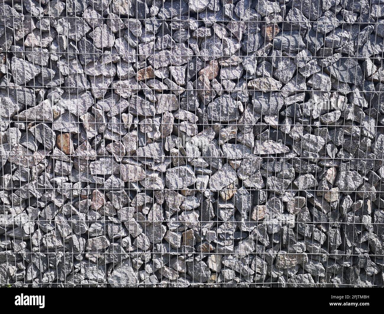 Gabion, metal basket filled with thick stones Stock Photo Alamy