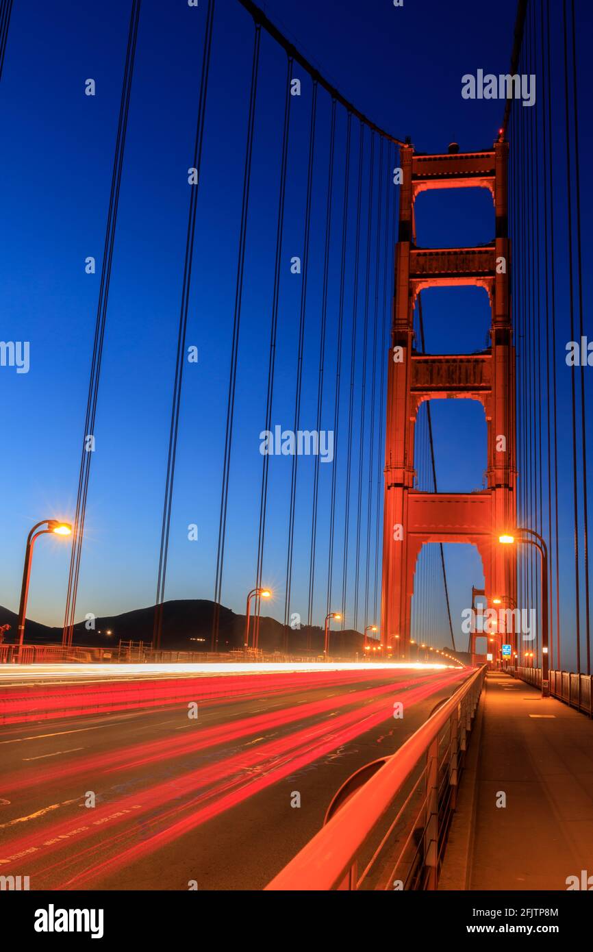 Car Light Trails over the Golden Gate Bridge via its Pedestrian Walkway during the Blue Hour. San Francisco, California, USA. Stock Photo
