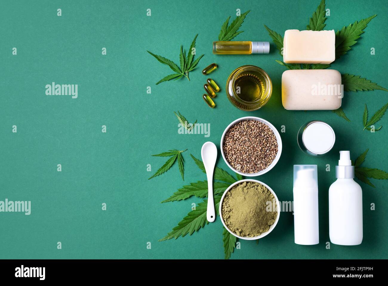 Flat lay with hemp extract products - cosmetics, lotion, face cream, body butter, soap bars, cannabis leaves, seeds, hemp oi, capsules, protein powder Stock Photo