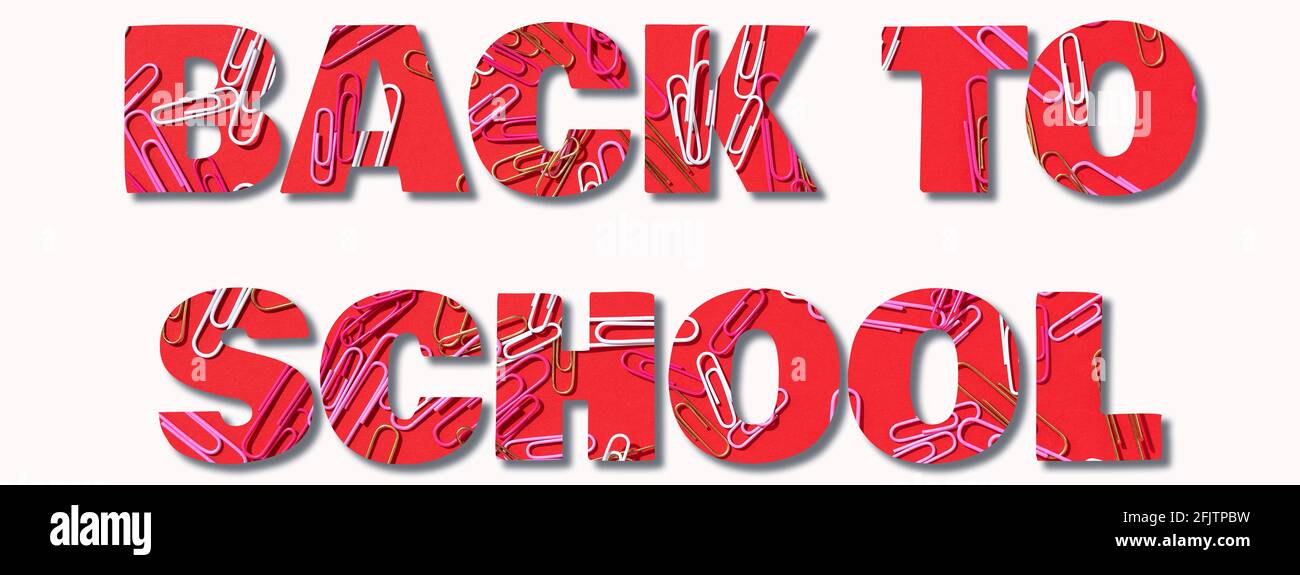 Inscription Back to school made with multicolored paper clips on red background. Back to school. Office, business, paperwork, education concept Stock Photo