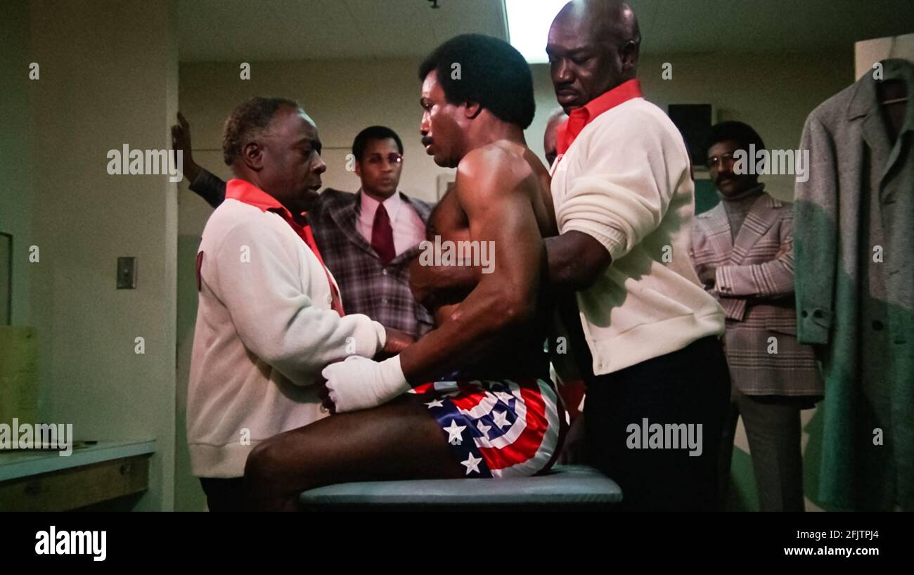 USA. Carl Weathers and Tony Burton in a scene from (C)United Artists film:  Rocky (1976). Plot: A small-time boxer gets a supremely rare chance to  fight a heavyweight champion in a bout