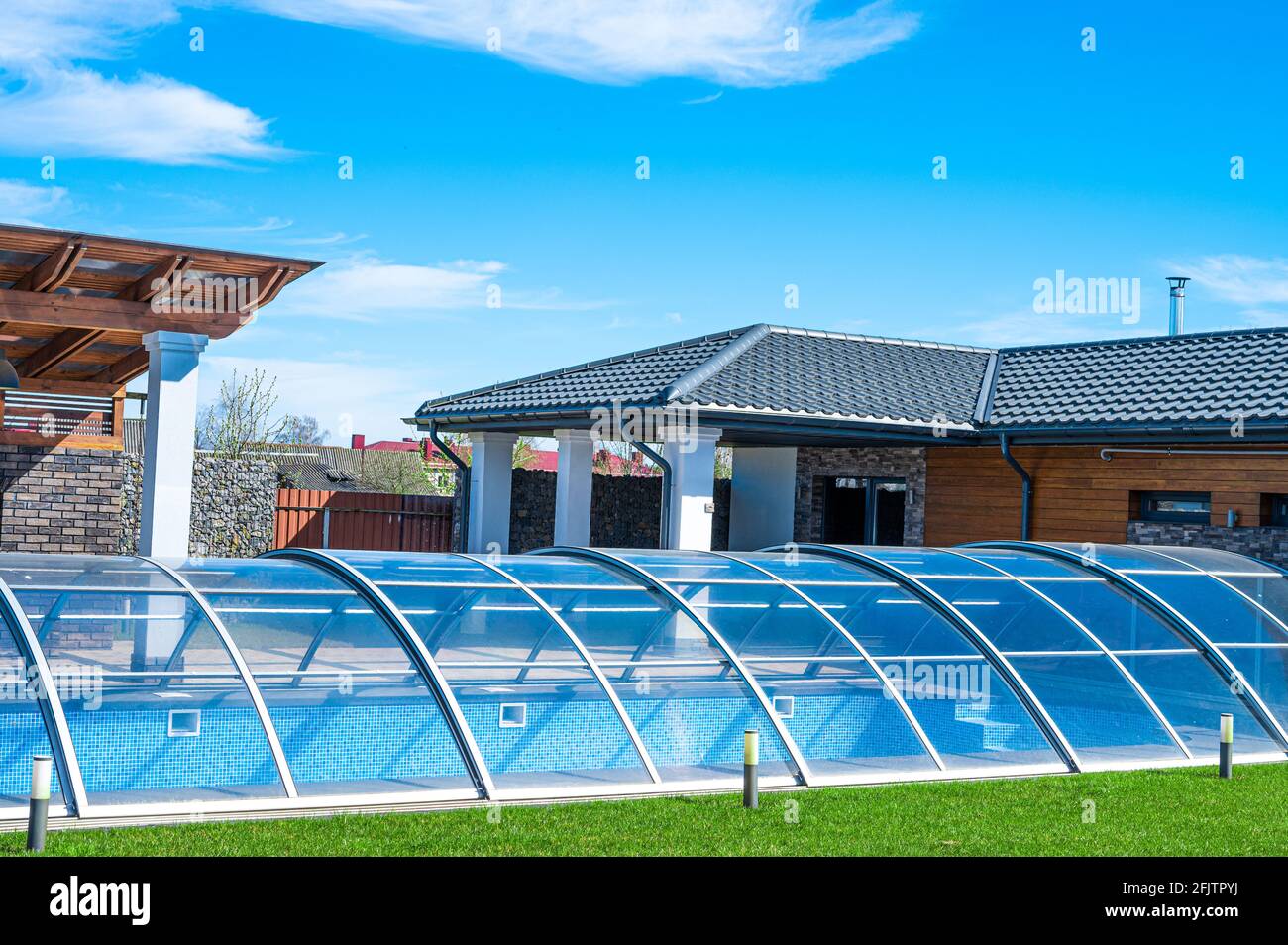Indoor private outdoor pool. glass covered pool with water indoor ...