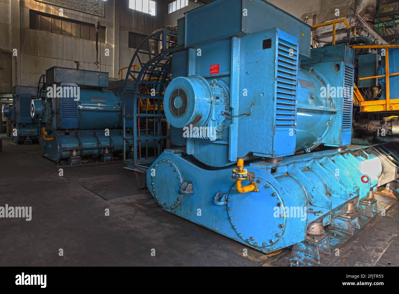 Big diesel generator in a power generation unit. Stock Photo