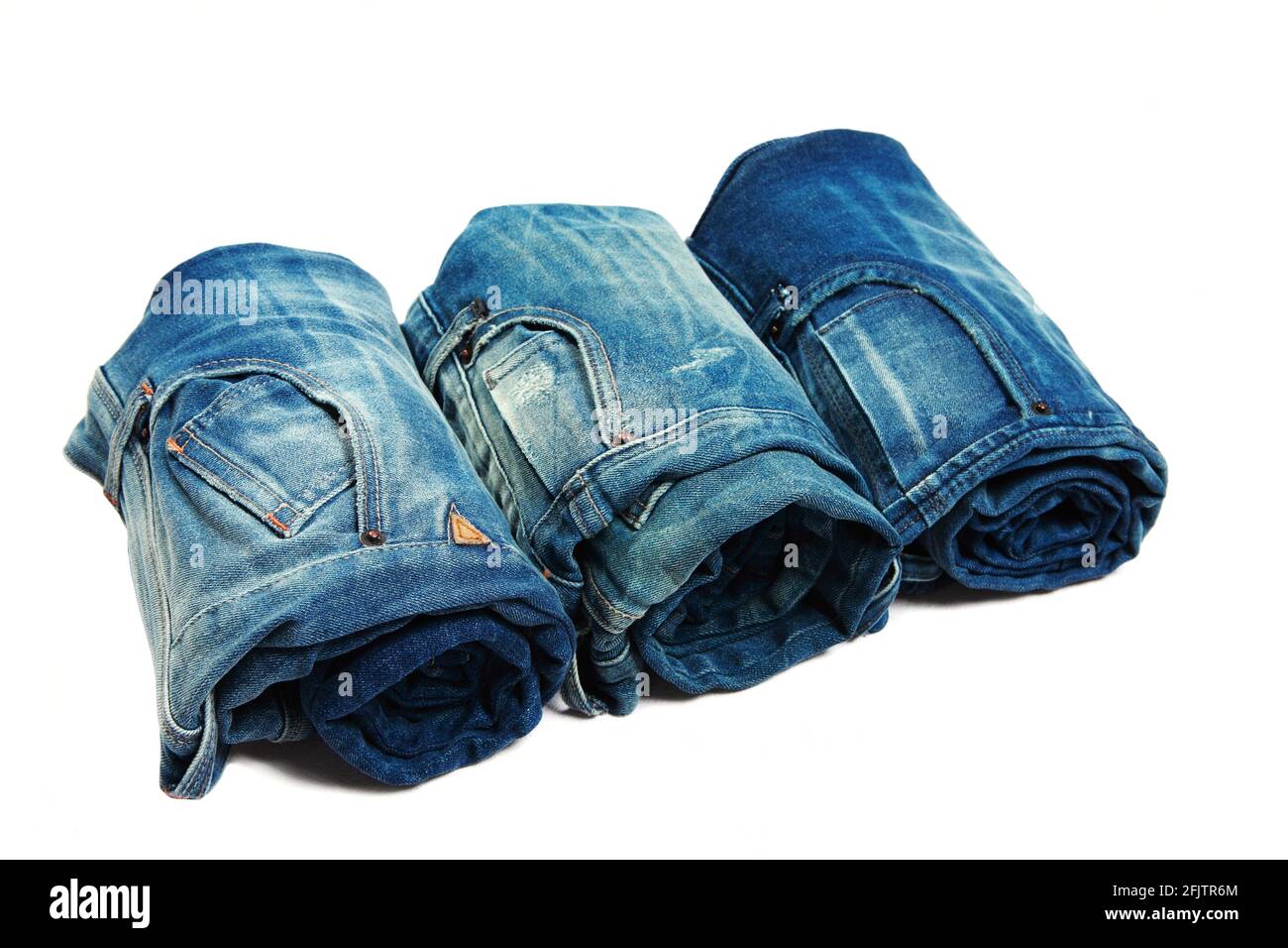 Rolled up Jeans pants over white Stock Photo Alamy