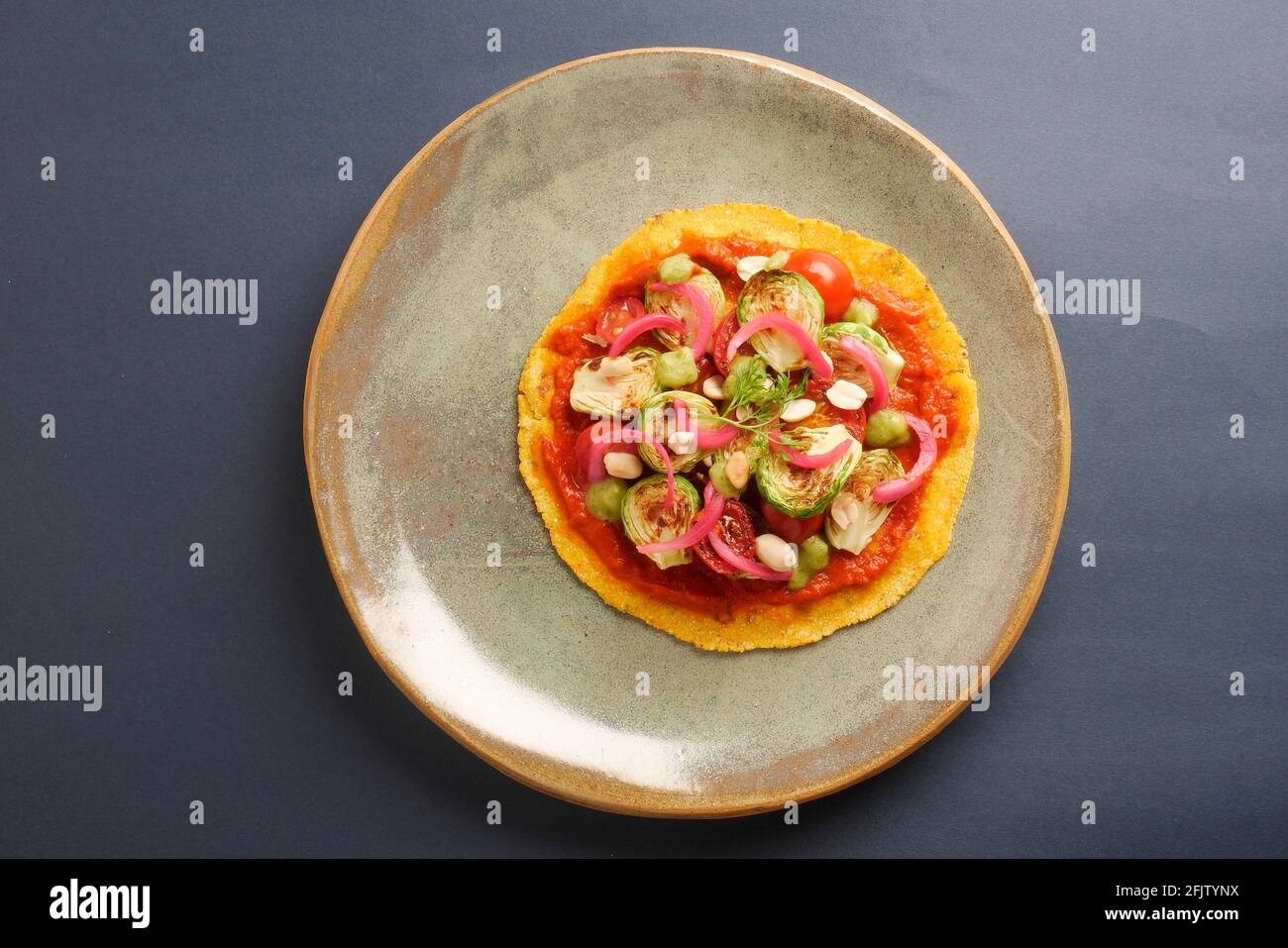 A STILL LIFE OF BRUSSEL SPROUT TACOS,WITH BRUSSEL SPROUTS, CHARRED AND
