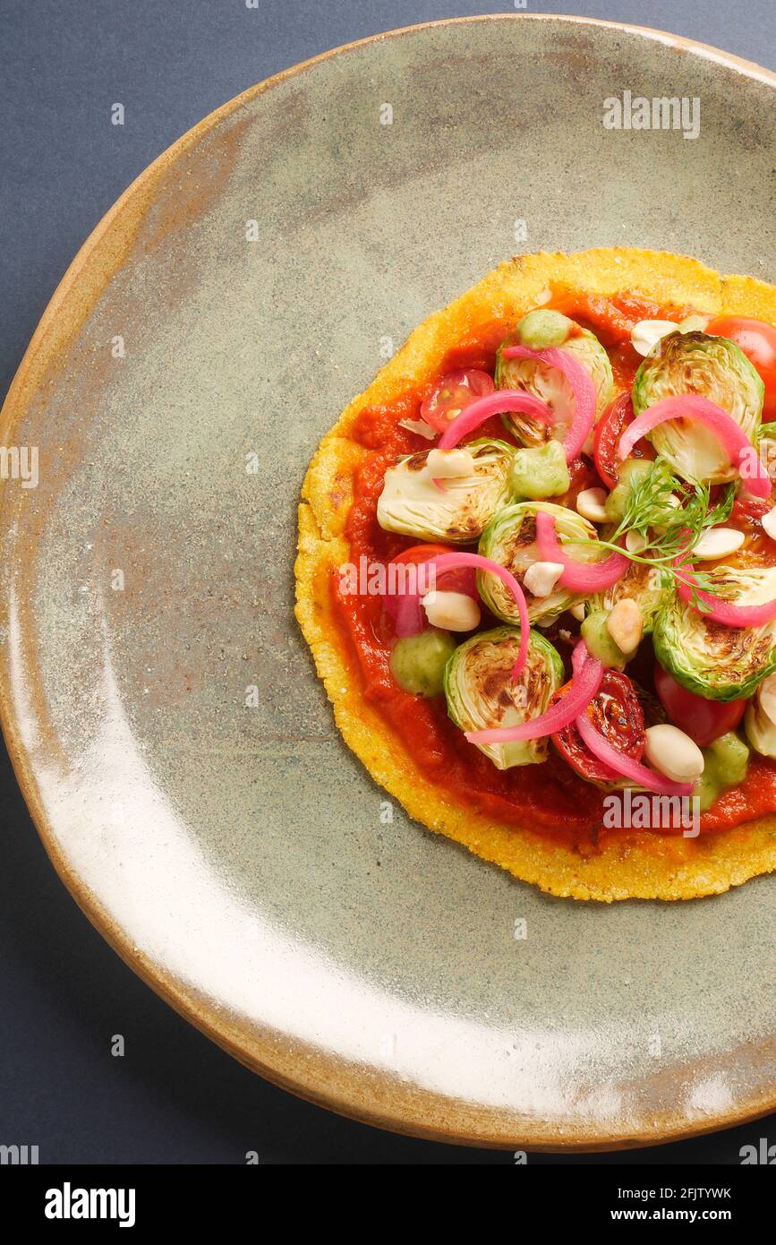 A STILL LIFE OF BRUSSEL SPROUT TACOS,WITH BRUSSEL SPROUTS, CHARRED AND