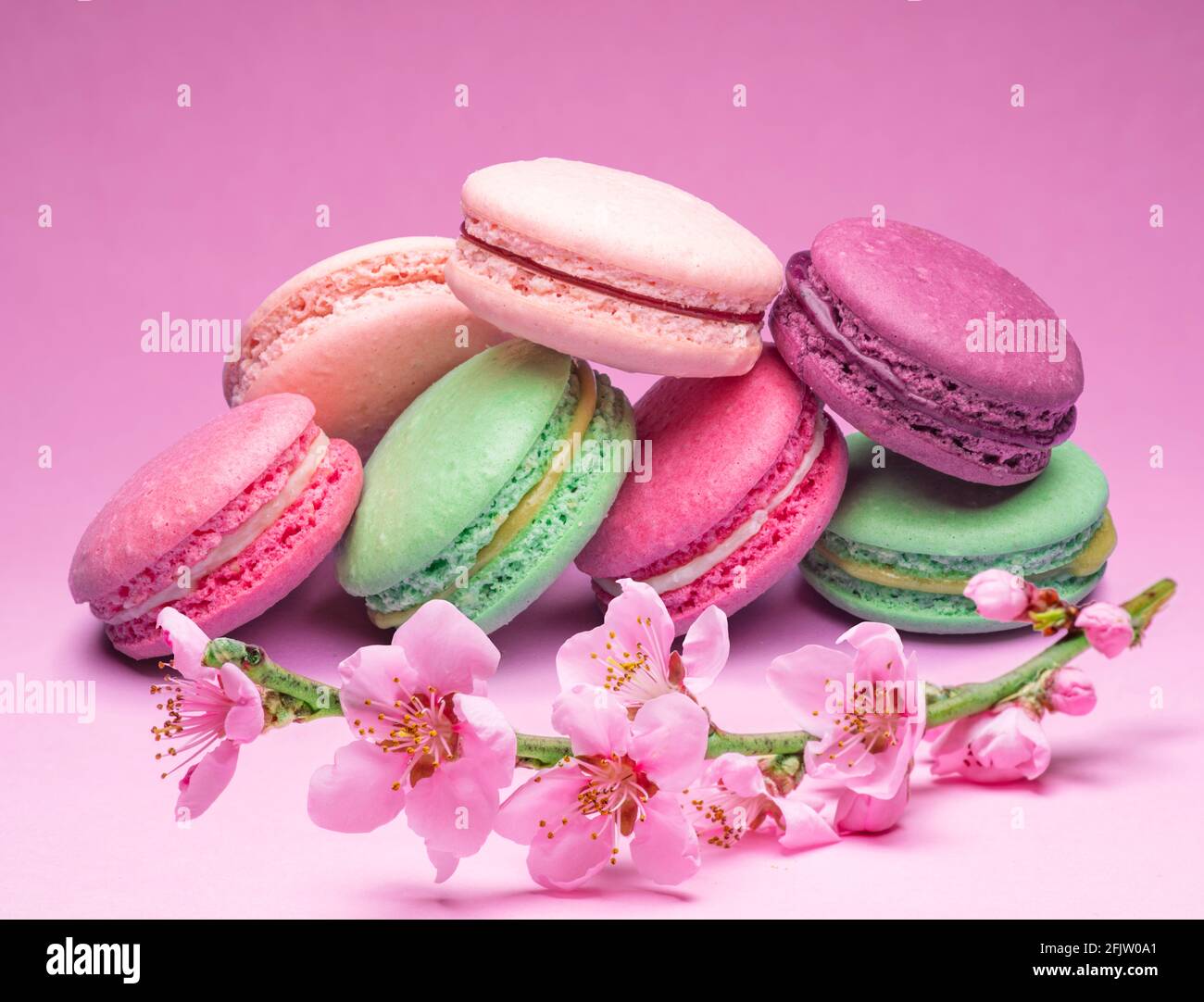 Colorful sweet macarons or macaroons, different flavored cookies on