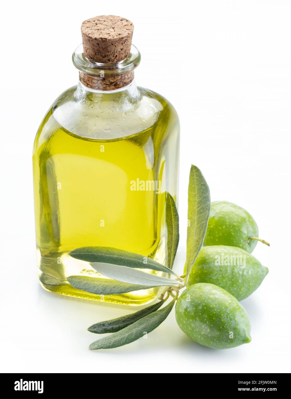 Green natural olives with bottle of olive oil isolated on a white ...