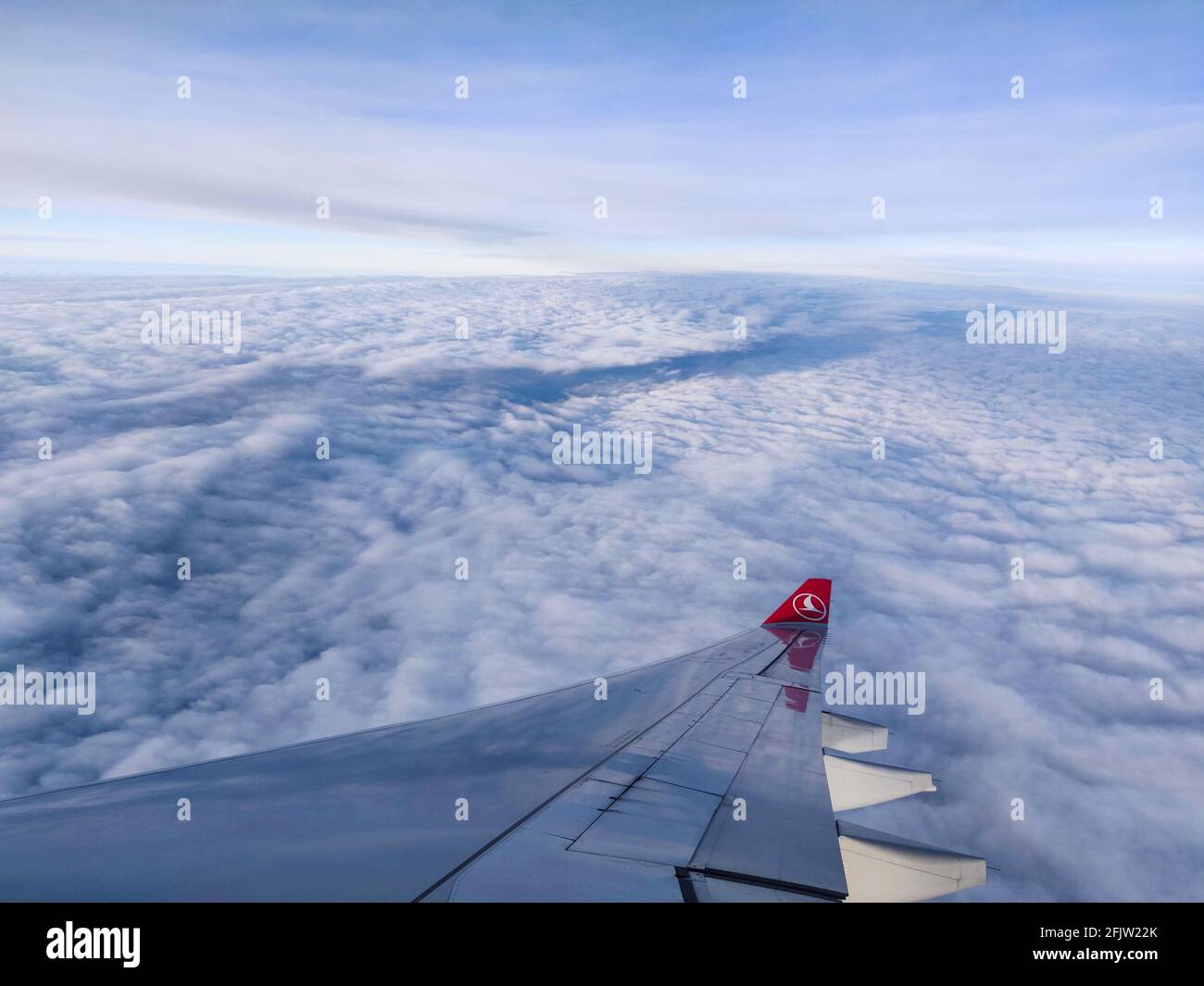 ISTANBUL, TURKEY - Mar 02, 2021: Flying above the clouds on Turkish Airlines Stock Photo