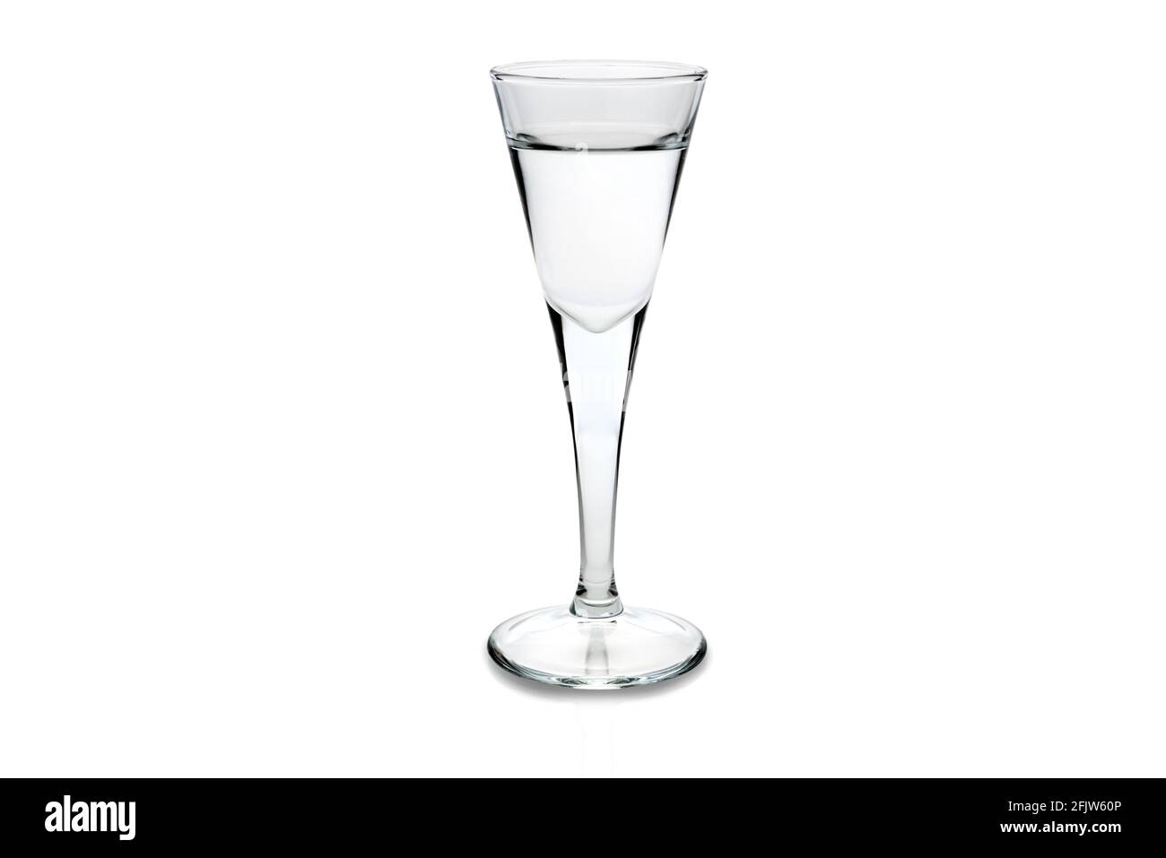 grappa or vodka in a goblet shot glass isolated on white Stock Photo