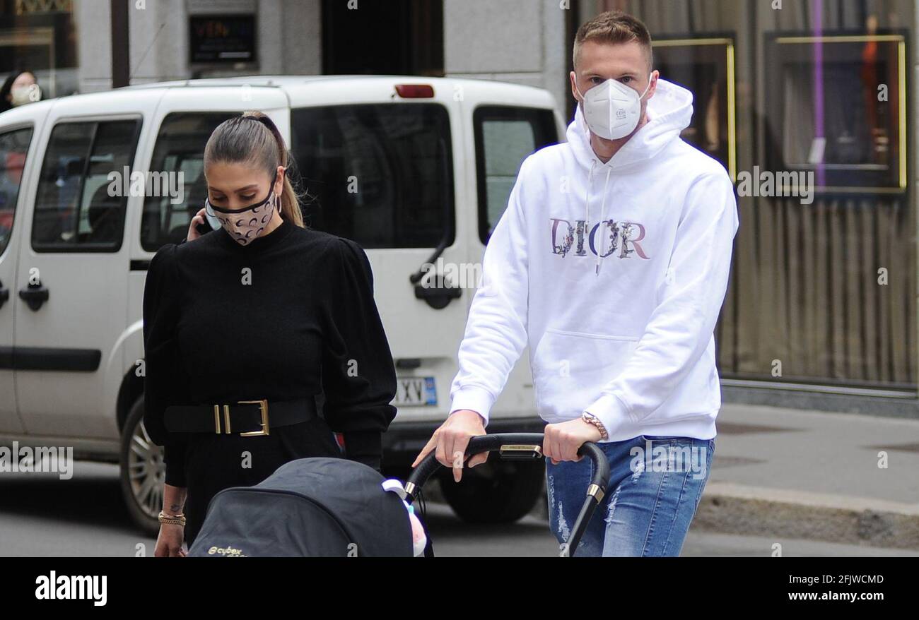 Milan, Milan Skriniar and family in the center Milan Skriniar, defender of INTER and the national team of SLOVAKIA. surprised walking through the streets of the center with his partner BARBORA HRONCEKOVA and little CHARLOTTE, born 6 months ago. Stock Photo