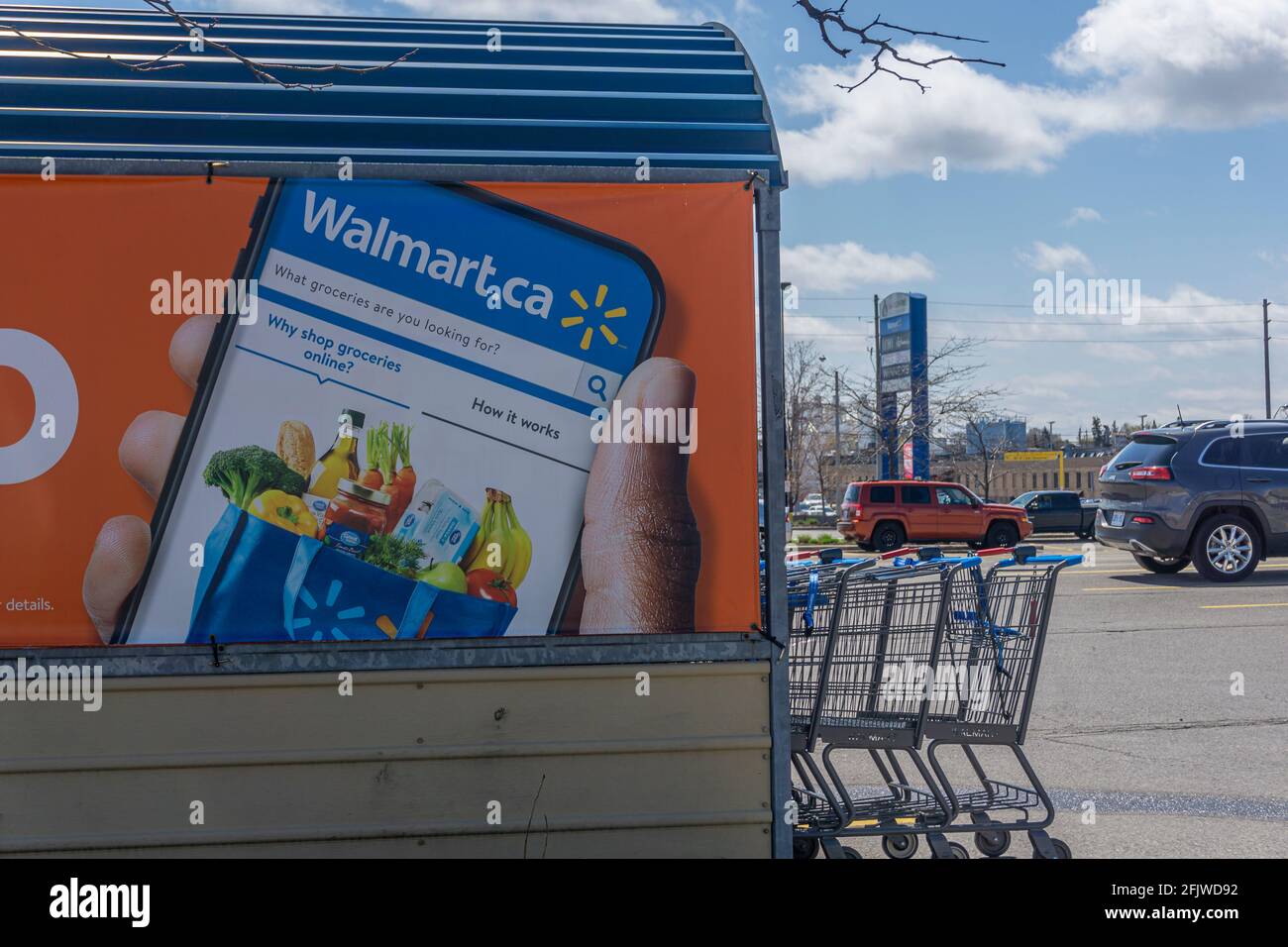 Toronto, Canada, April 2021 - A sign in the parking lot of a Walmart store for ordering groceries online and pickup  Stock Photo