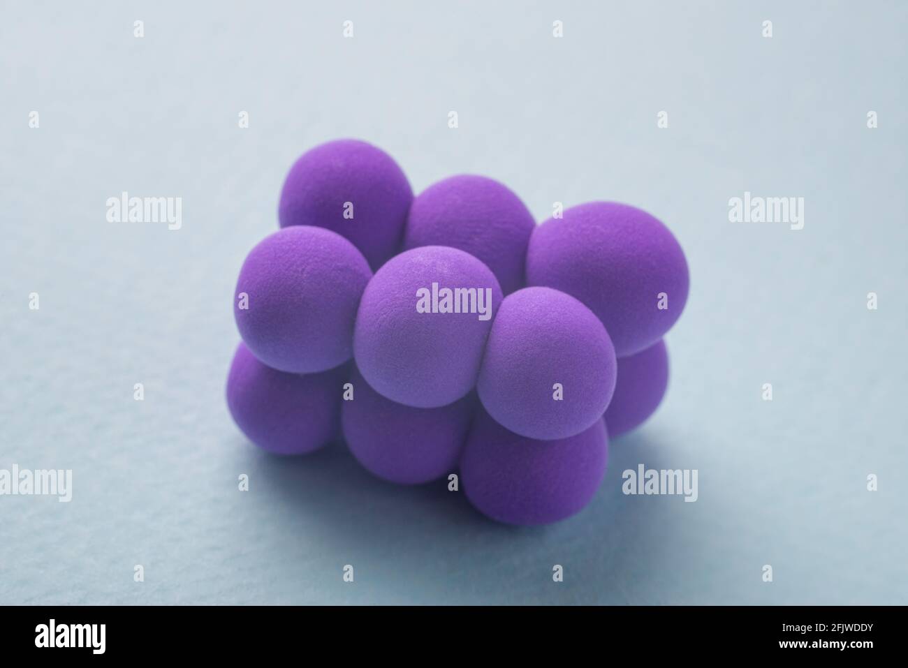 closeup of a pyogenic streptococcus model, against a blue background. Stock Photo