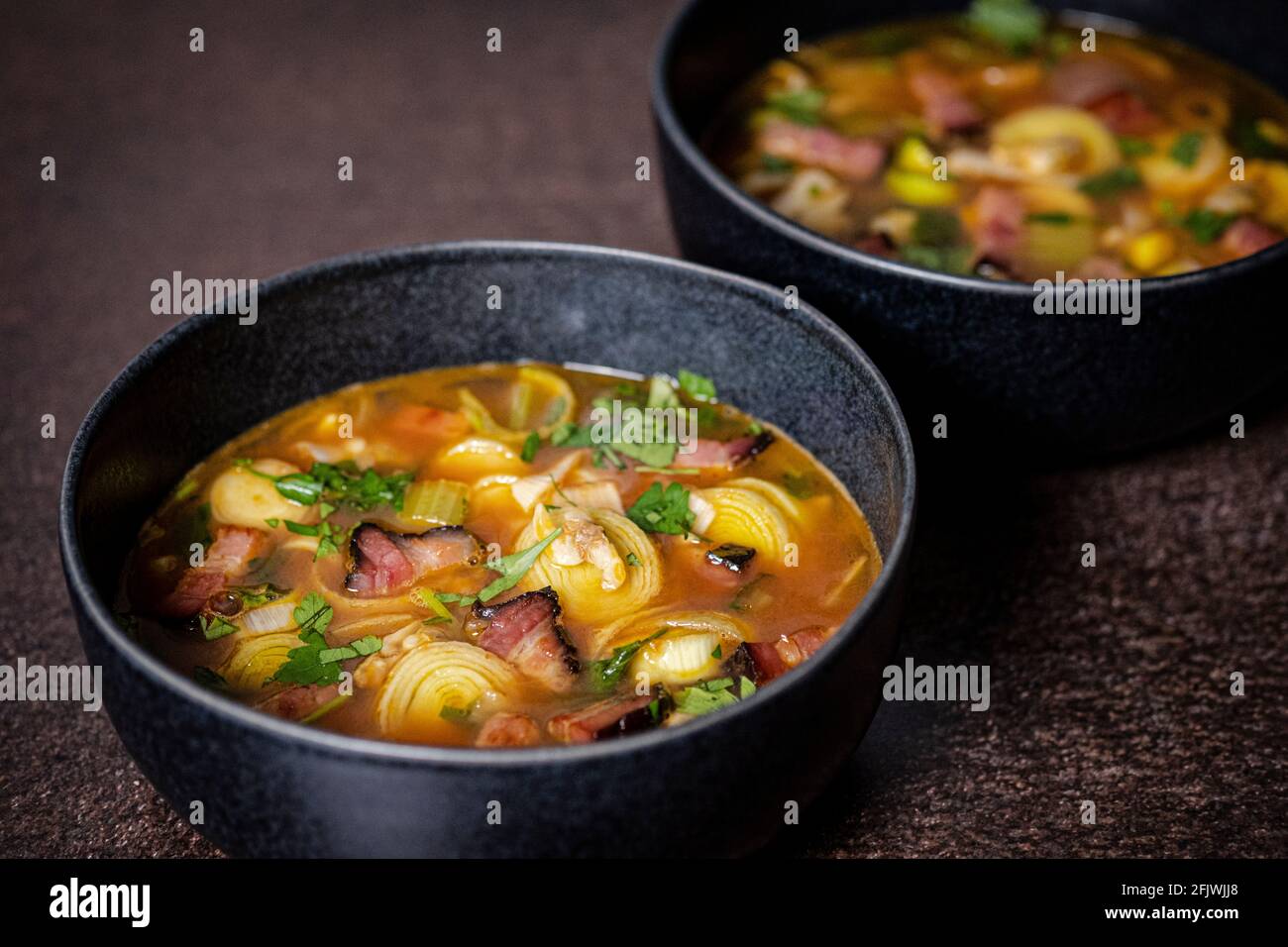 Clams, smoked pork belly, leek and potato soup Stock Photo