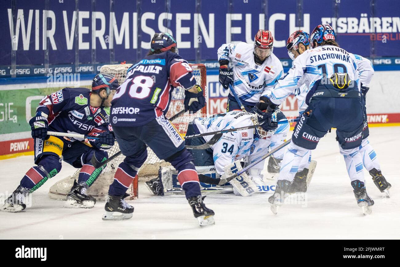 Berlin, Germany. 26th Apr, 2021. Ice hockey: DEL, Eisbären Berlin - ERC Ingolstadt, championship round, semi-final, matchday 1, Mercedes-Benz Arena. Berlin's Matt White (l-r) and Kris Foucault fight for the puck against goalie Michael Garteig, Ben Marshall, Emil Quaas and Wojciech Stachowiak of ERC Ingolstadt. Credit: Andreas Gora/dpa/Alamy Live News Stock Photo