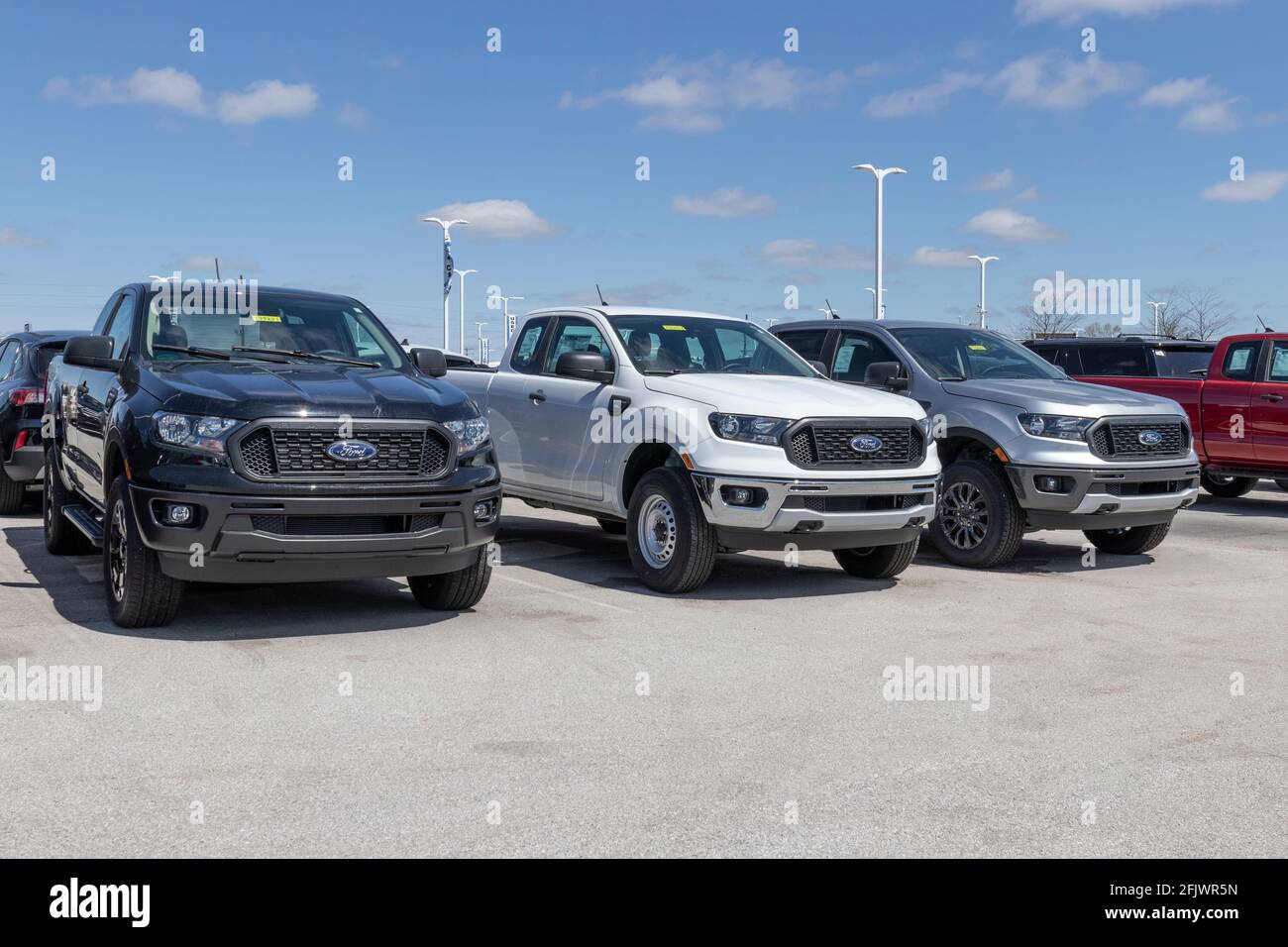 Plainfield - Circa April 2021: Ford Ranger pickup truck display at a dealership. The Ranger nameplate has been used on multiple light duty truck model Stock Photo