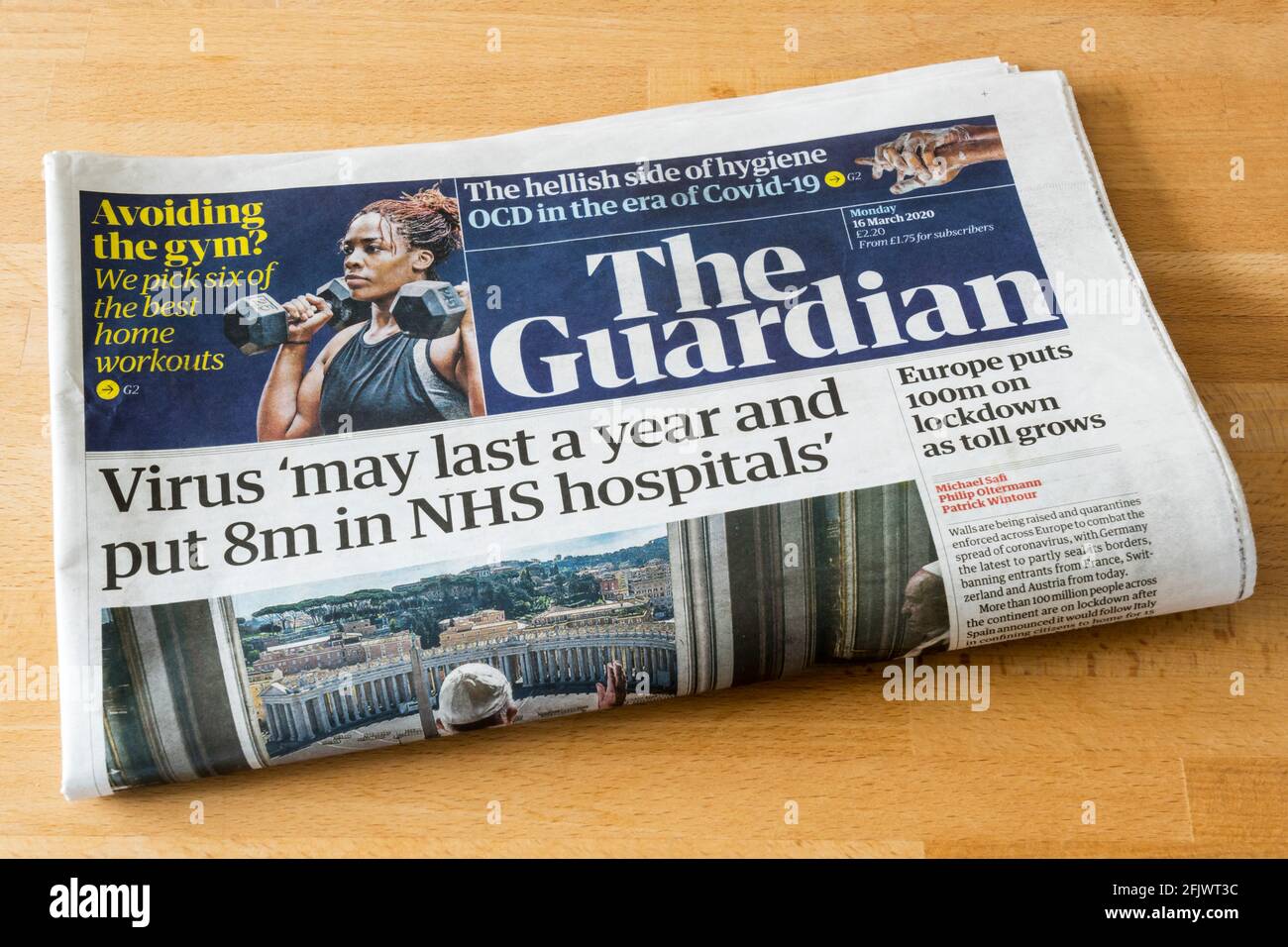 Headline on front page of The Guardian newspaper of 16 March 2020 says 'Virus may last a year and put 8m in NHS hospitals.' Stock Photo