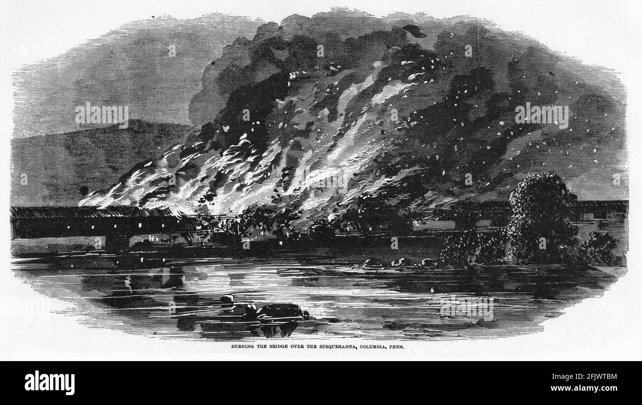 Engraving of the bridge at susquehanna, Columbia, Pennsylvania burning during the American civil war: Stock Photo